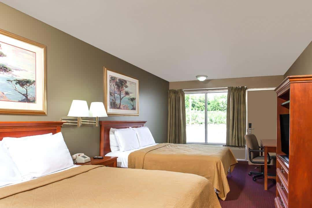 Hotel room with two double beds.