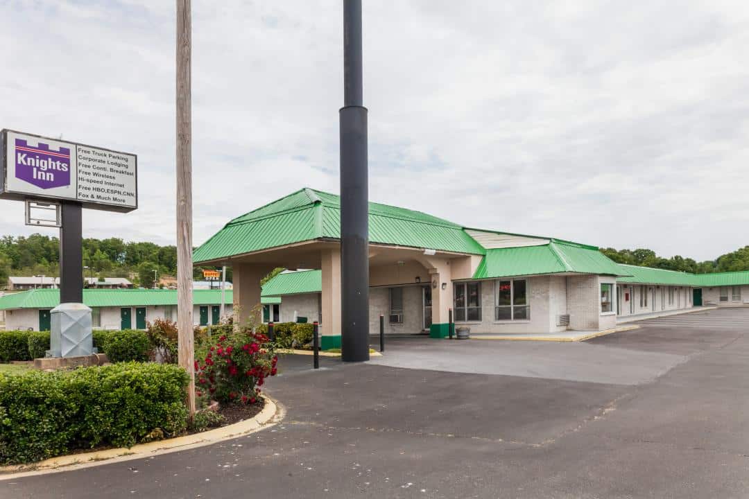Hotel exterior at noon.