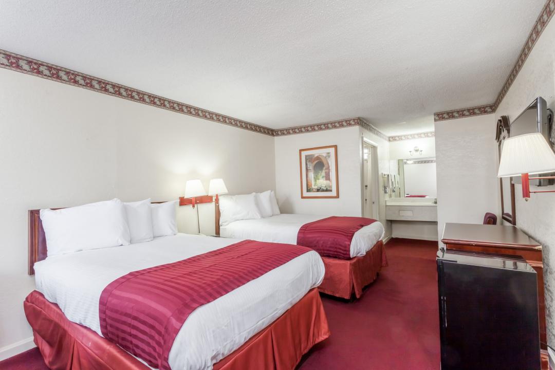 Hotel room with two double beds.