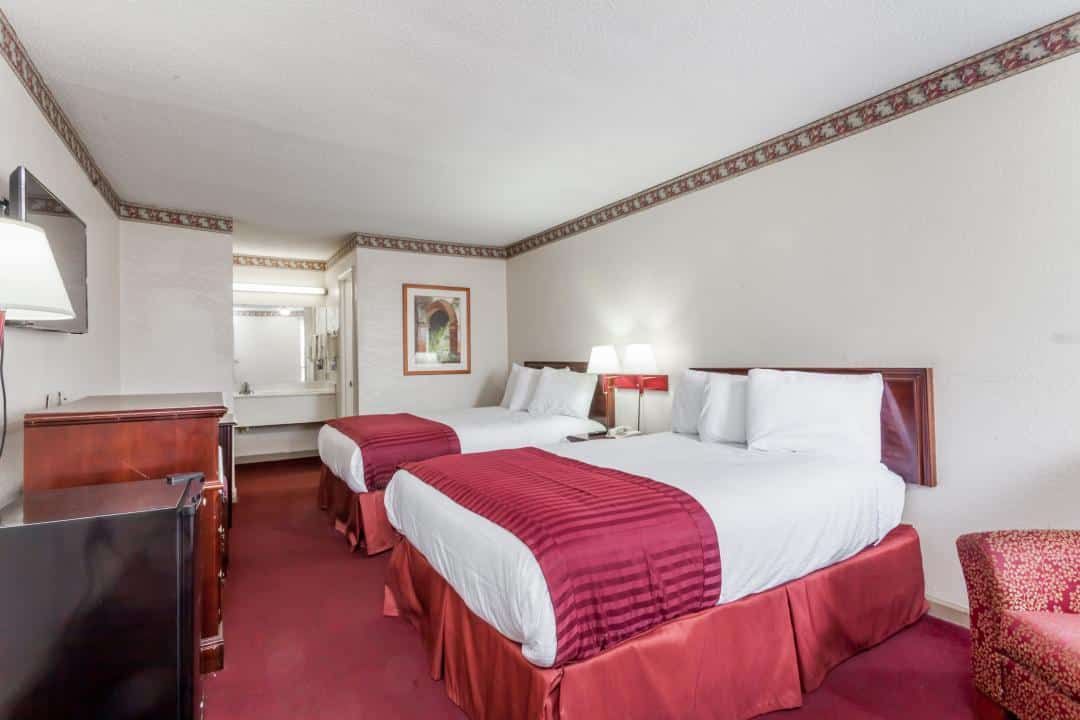 Hotel room with two double beds.