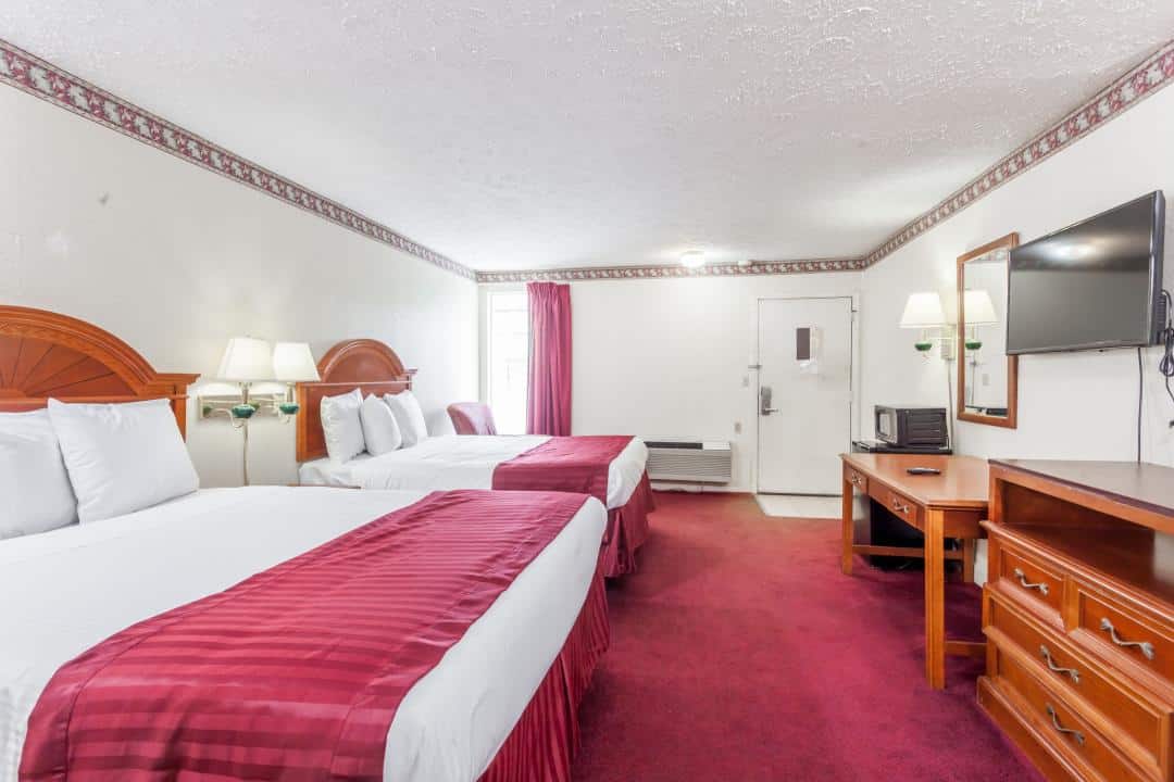 Hotel room with two double beds.