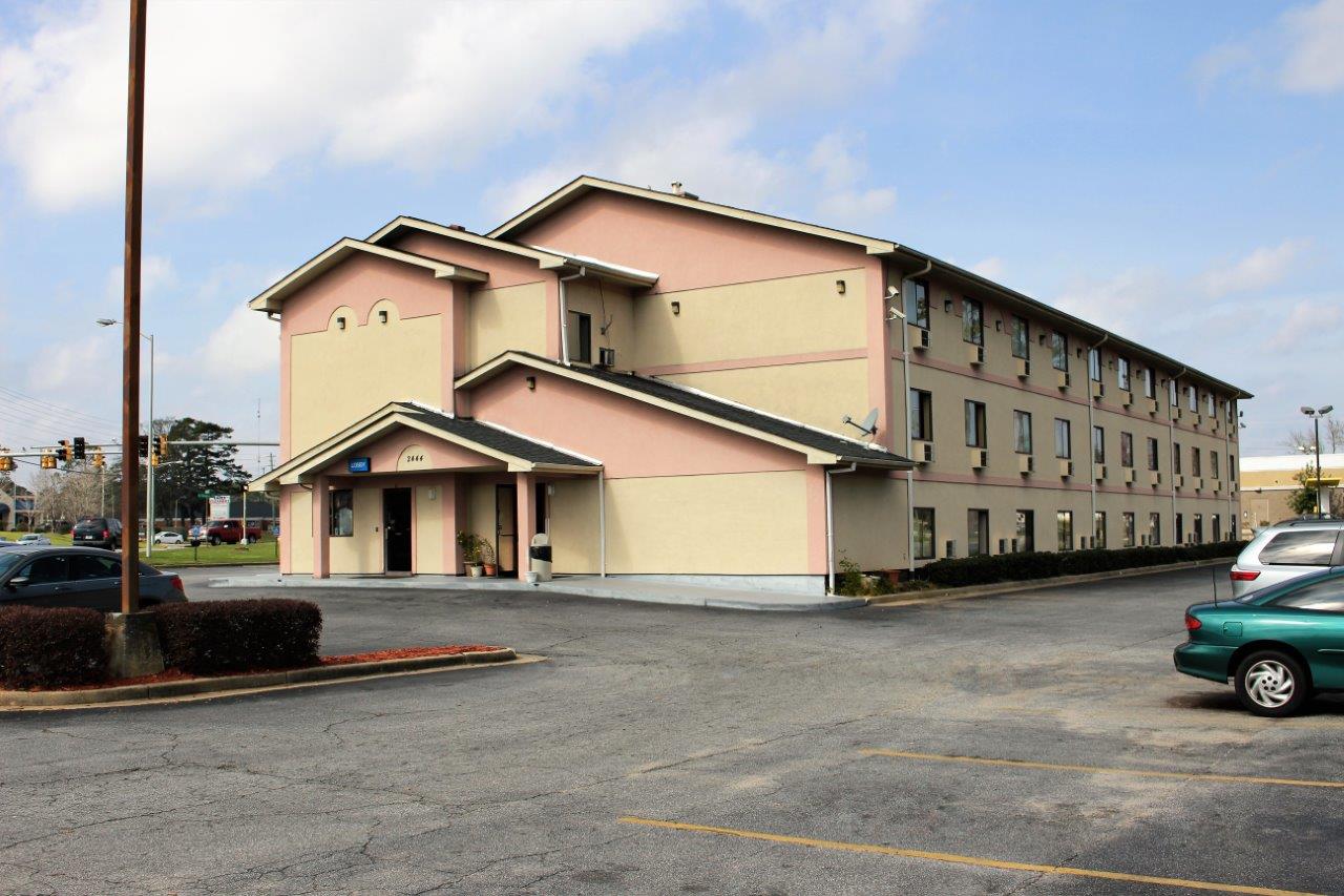 Hotel exterior at noon.