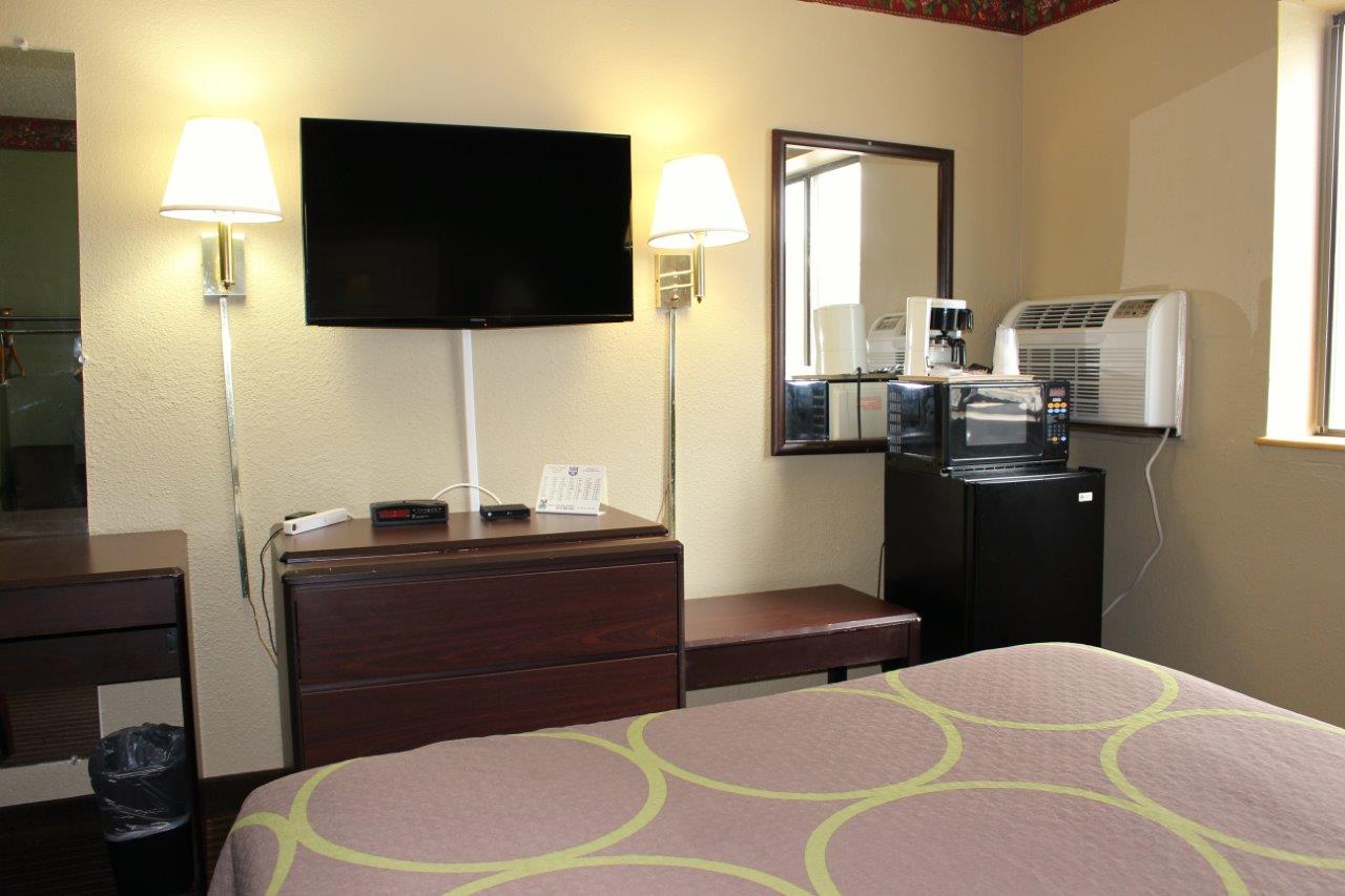 Hotel room TV and seating area.