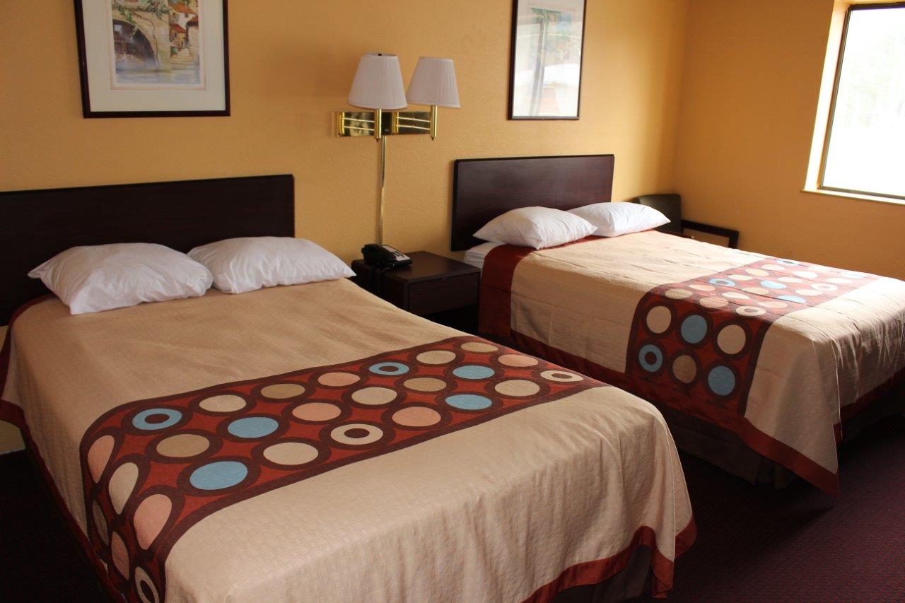 Hotel room with two double beds.