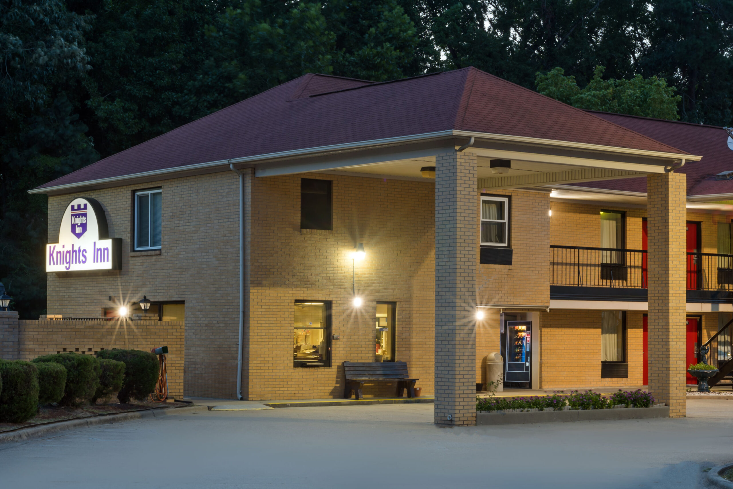 Hotel exterior at night.