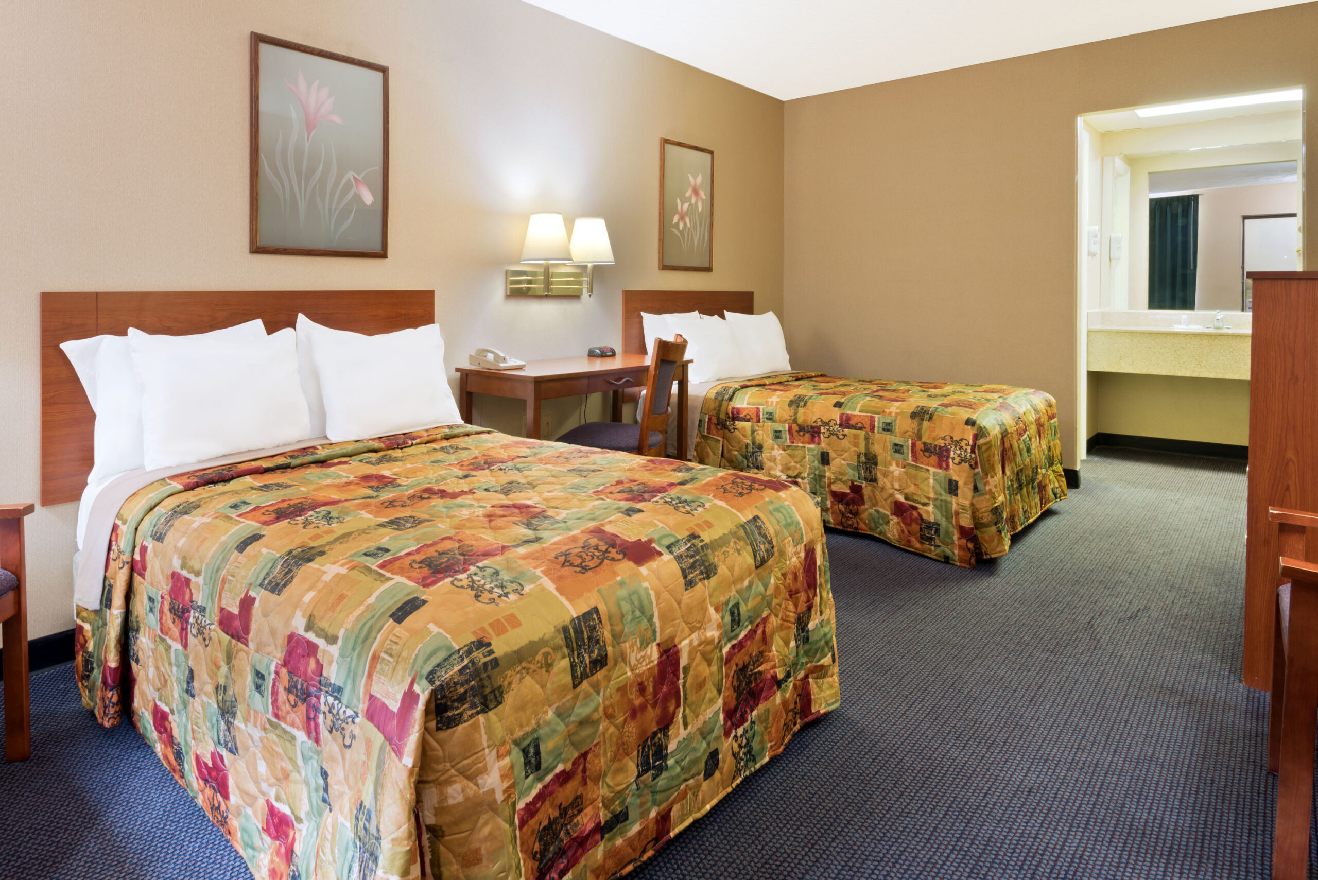 Hotel room with two double beds.