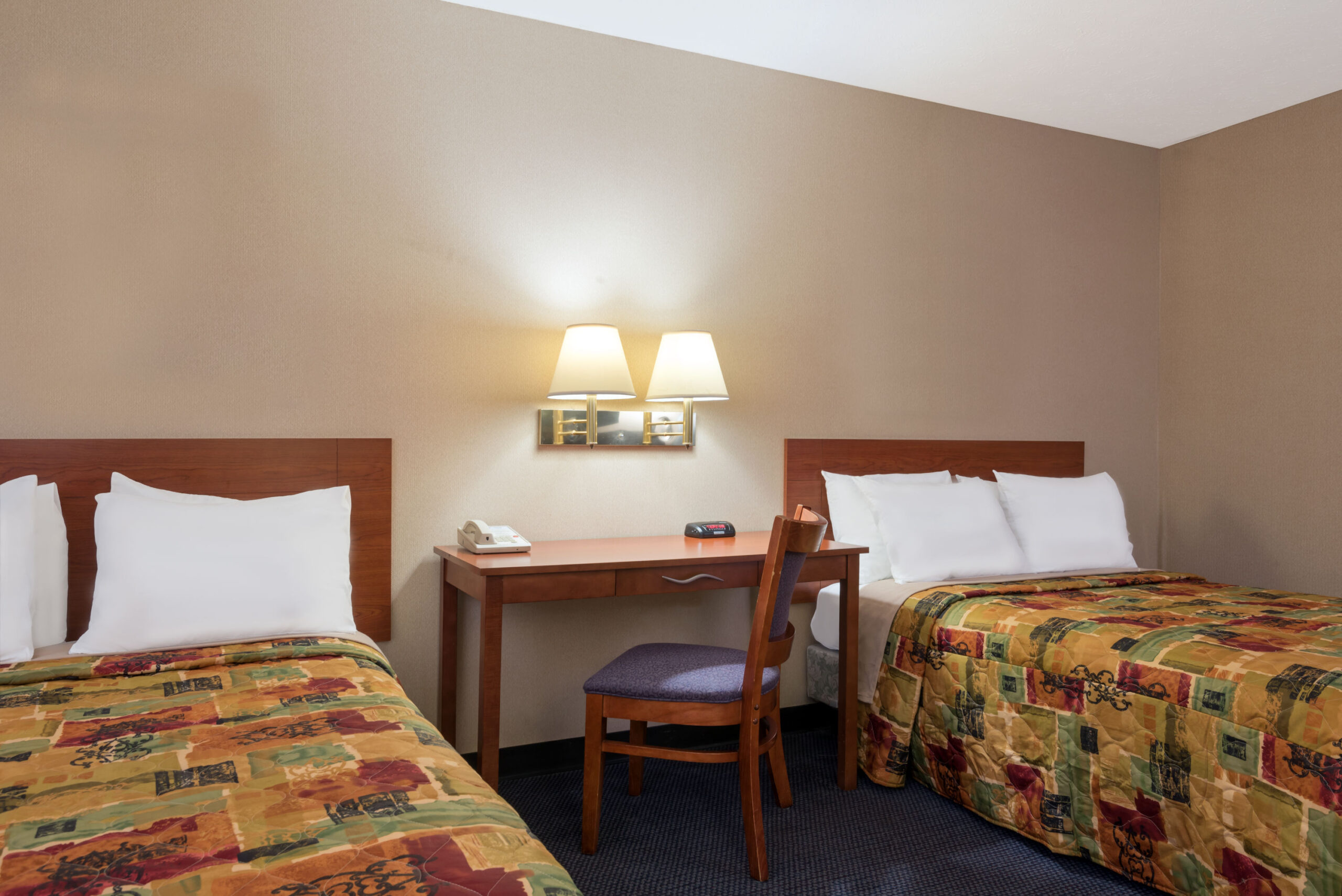 Hotel room with two double beds.