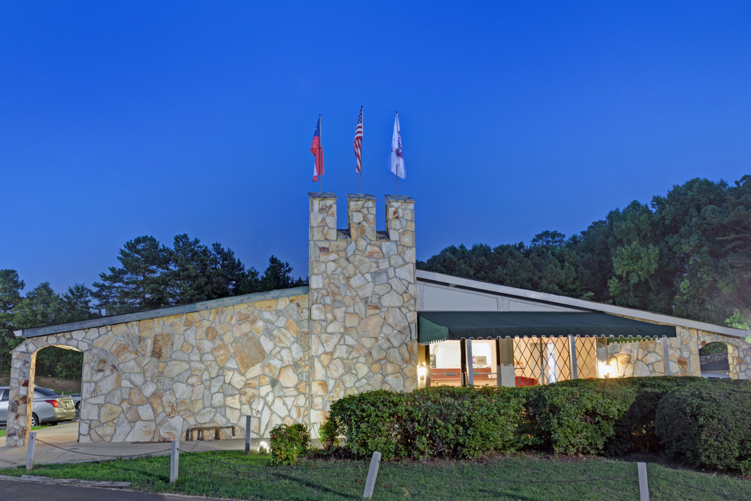 Hotel exterior at night.