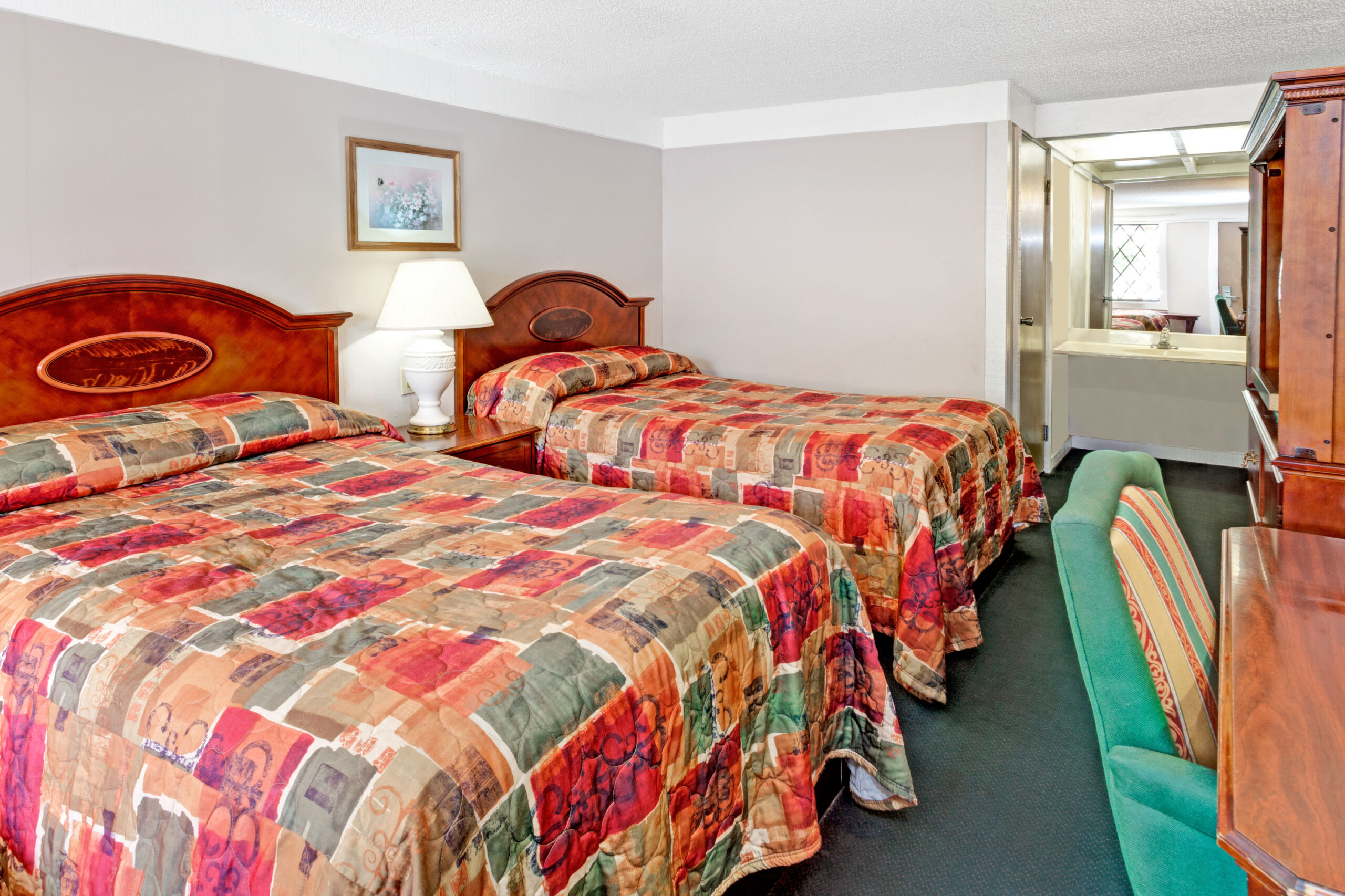 Hotel room with two double beds.
