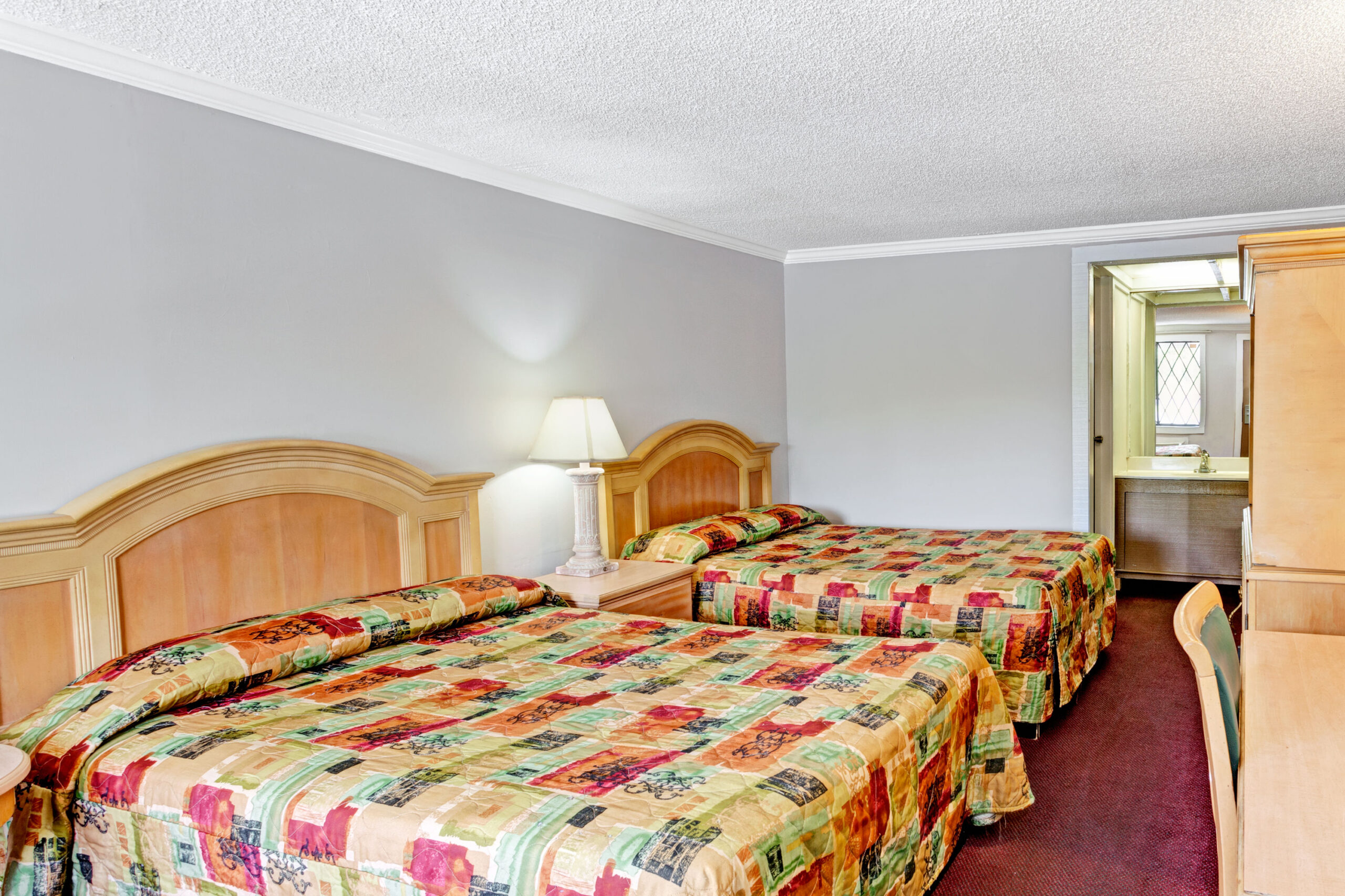 Hotel room with two double beds.