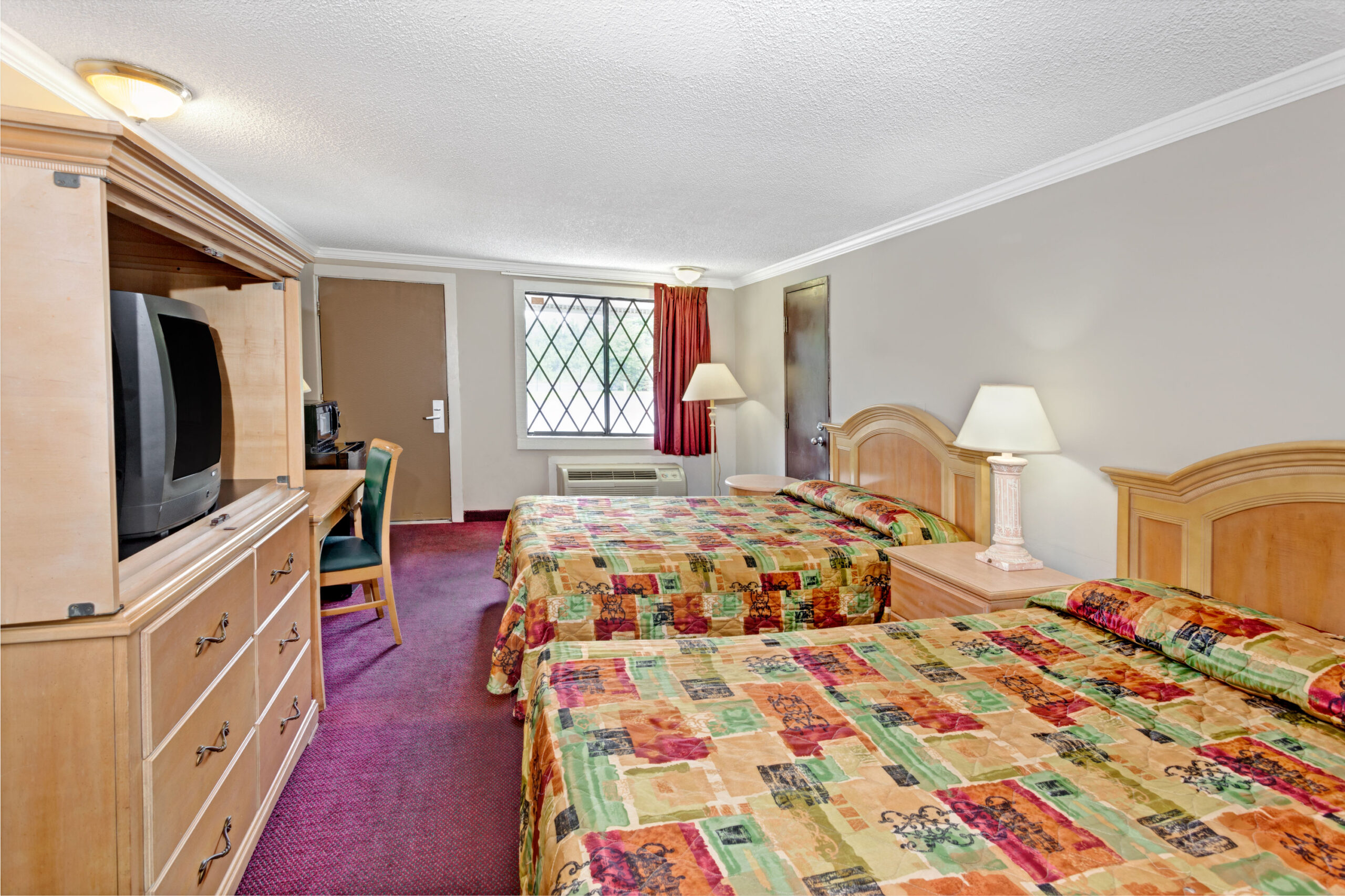 Hotel room with two double beds.