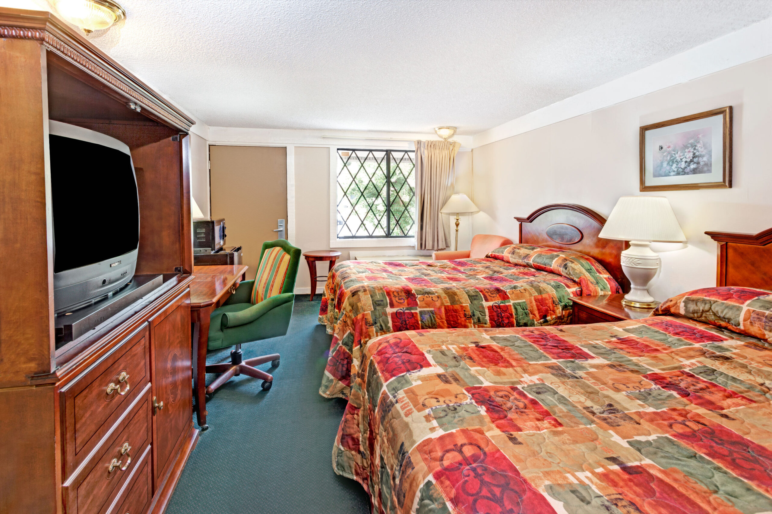 Hotel room with two double beds.
