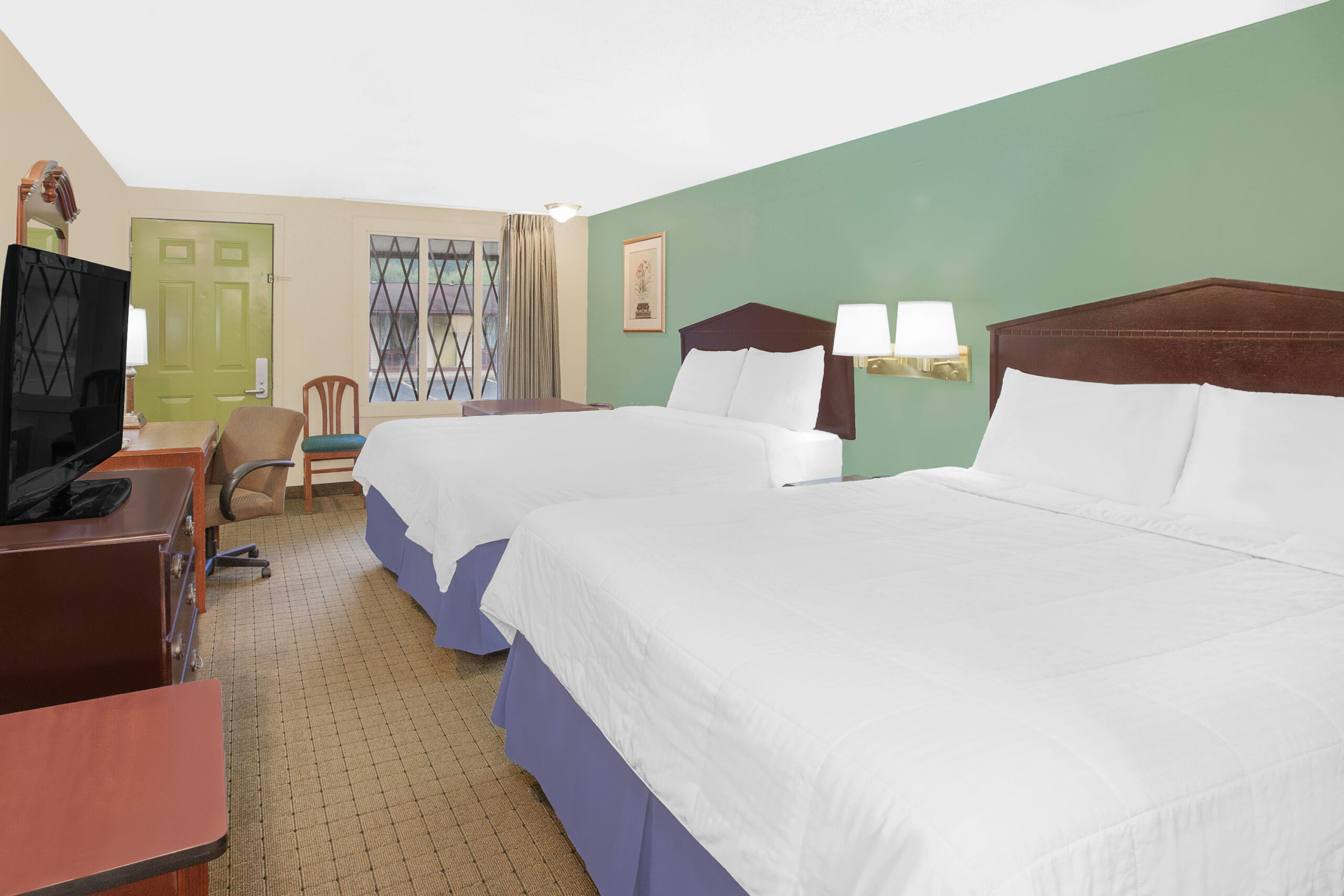Hotel room with two double beds.