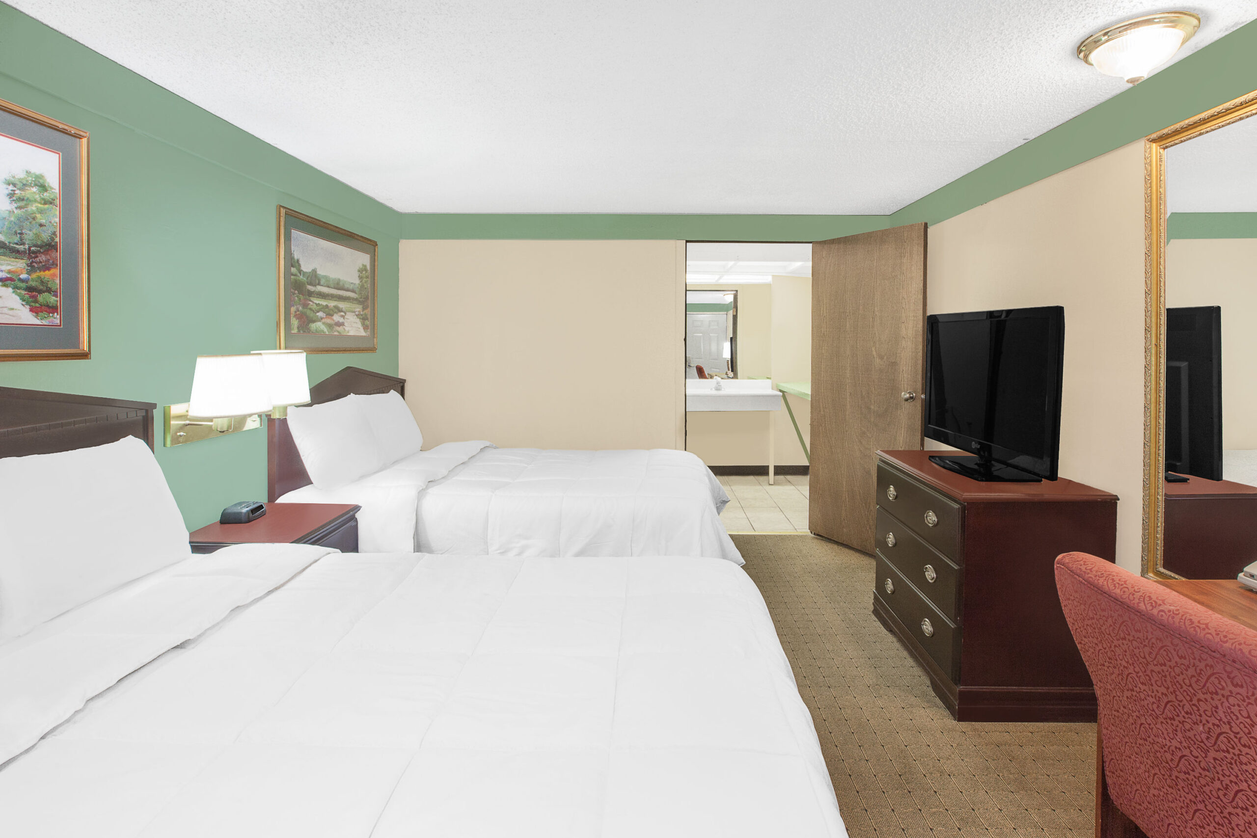Hotel room with two double beds.