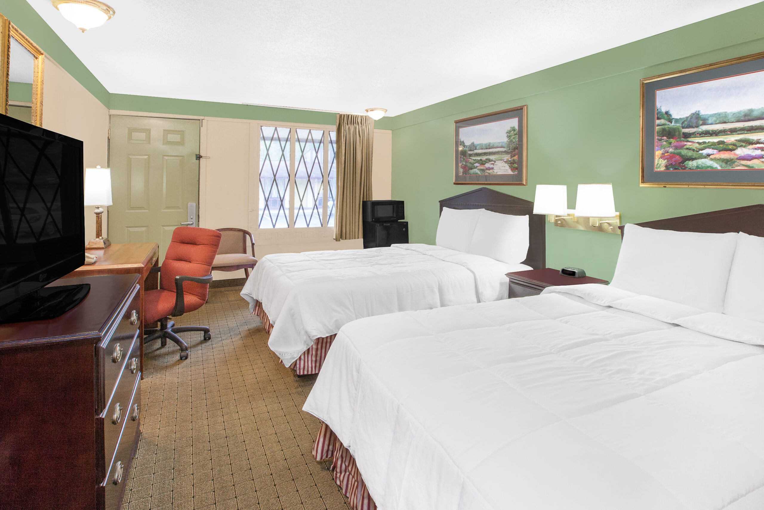 Hotel room with two double beds.