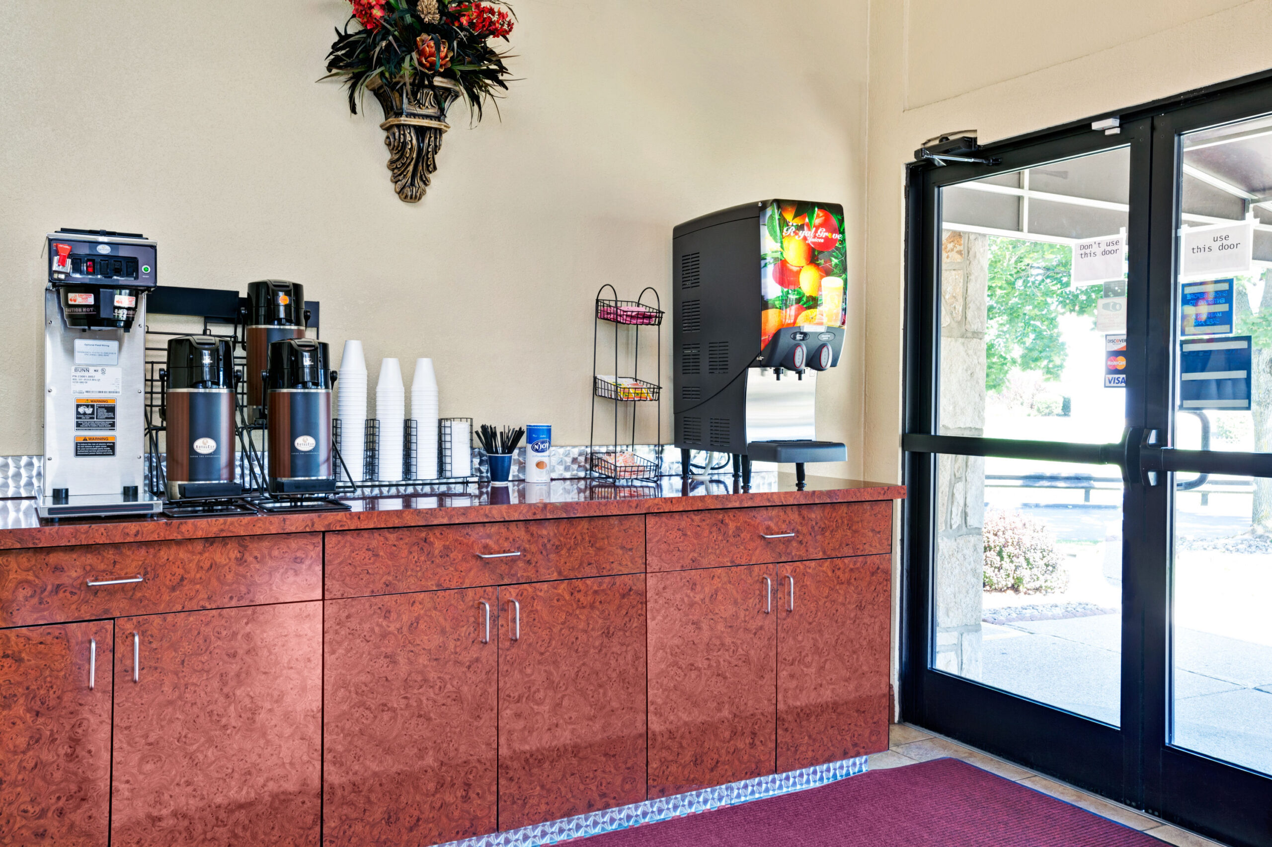 Coffee and beverage station in hotel lobby.