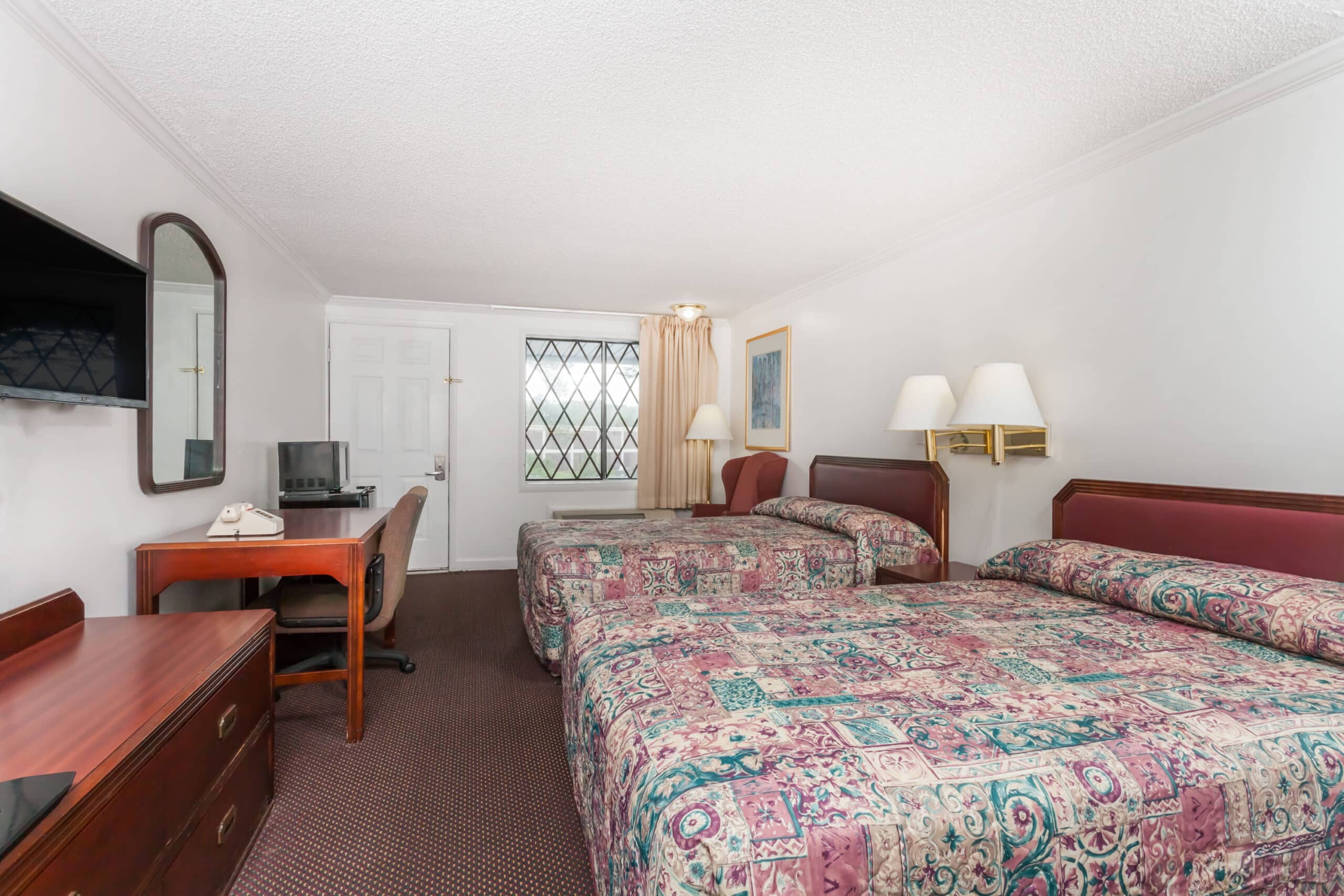 Hotel room with two double beds.