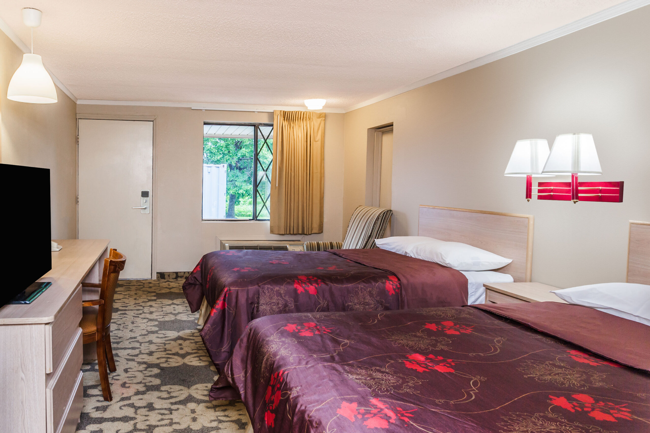 Hotel room with two double beds.