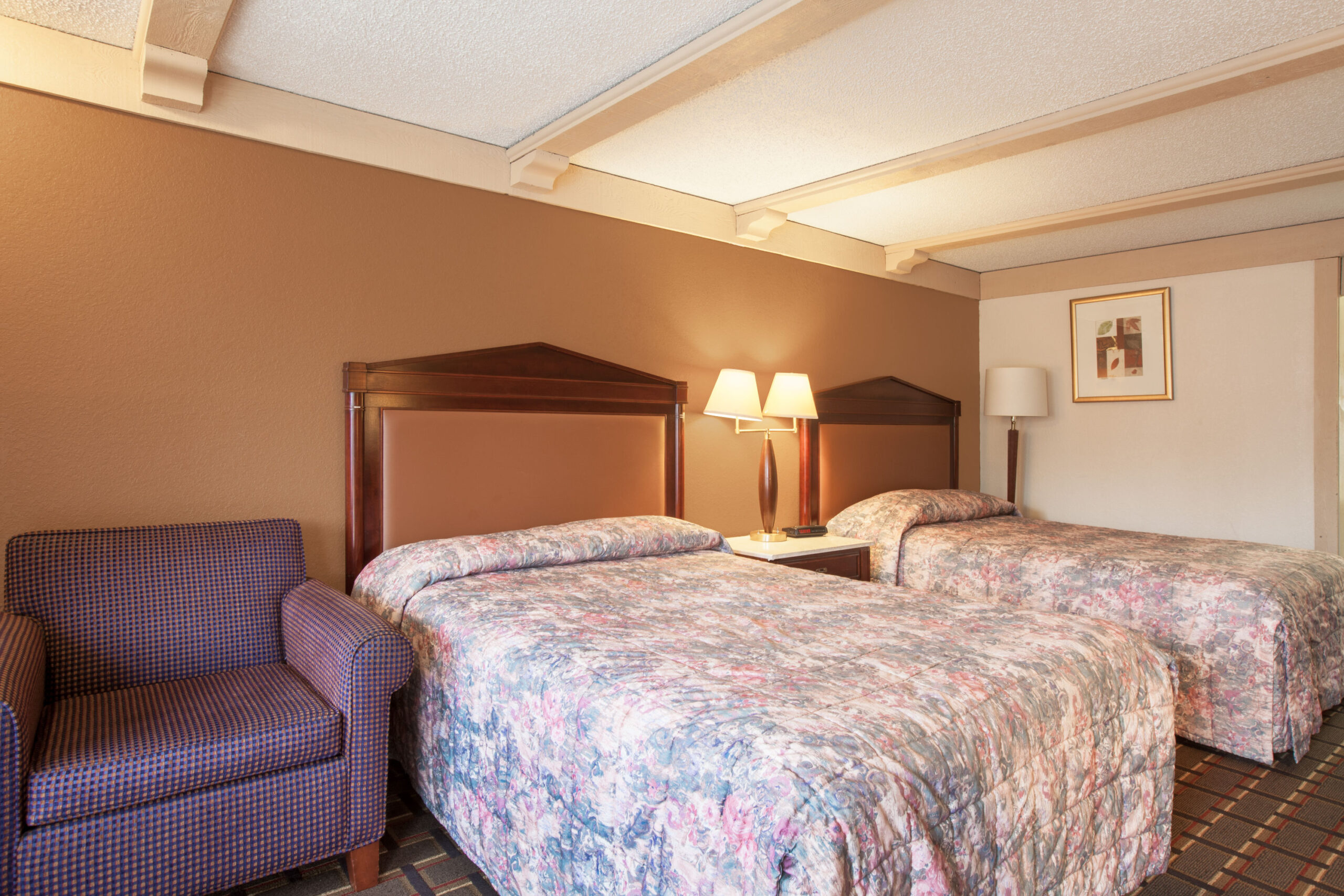 Hotel room with two double beds.