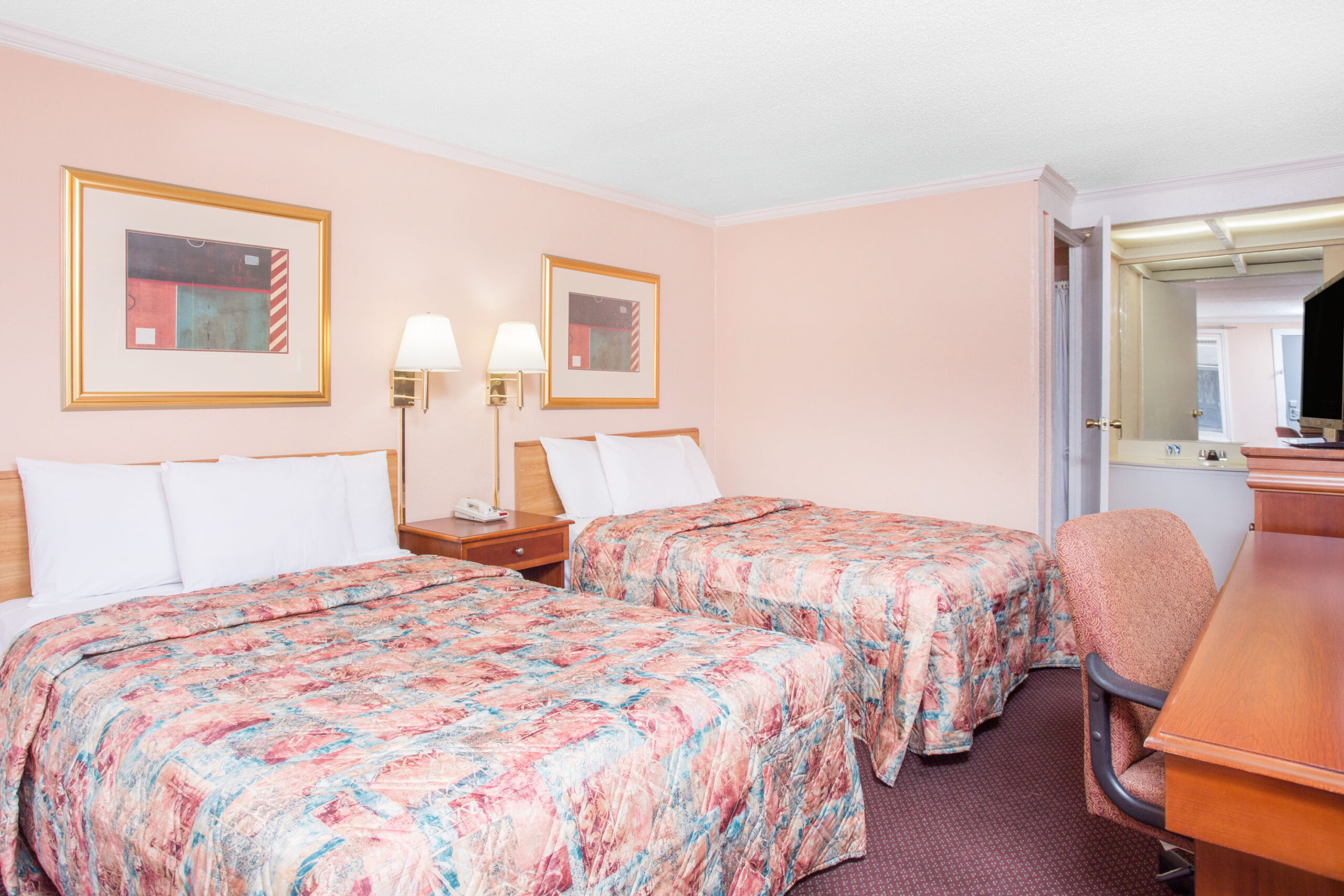 Hotel room with two double beds.