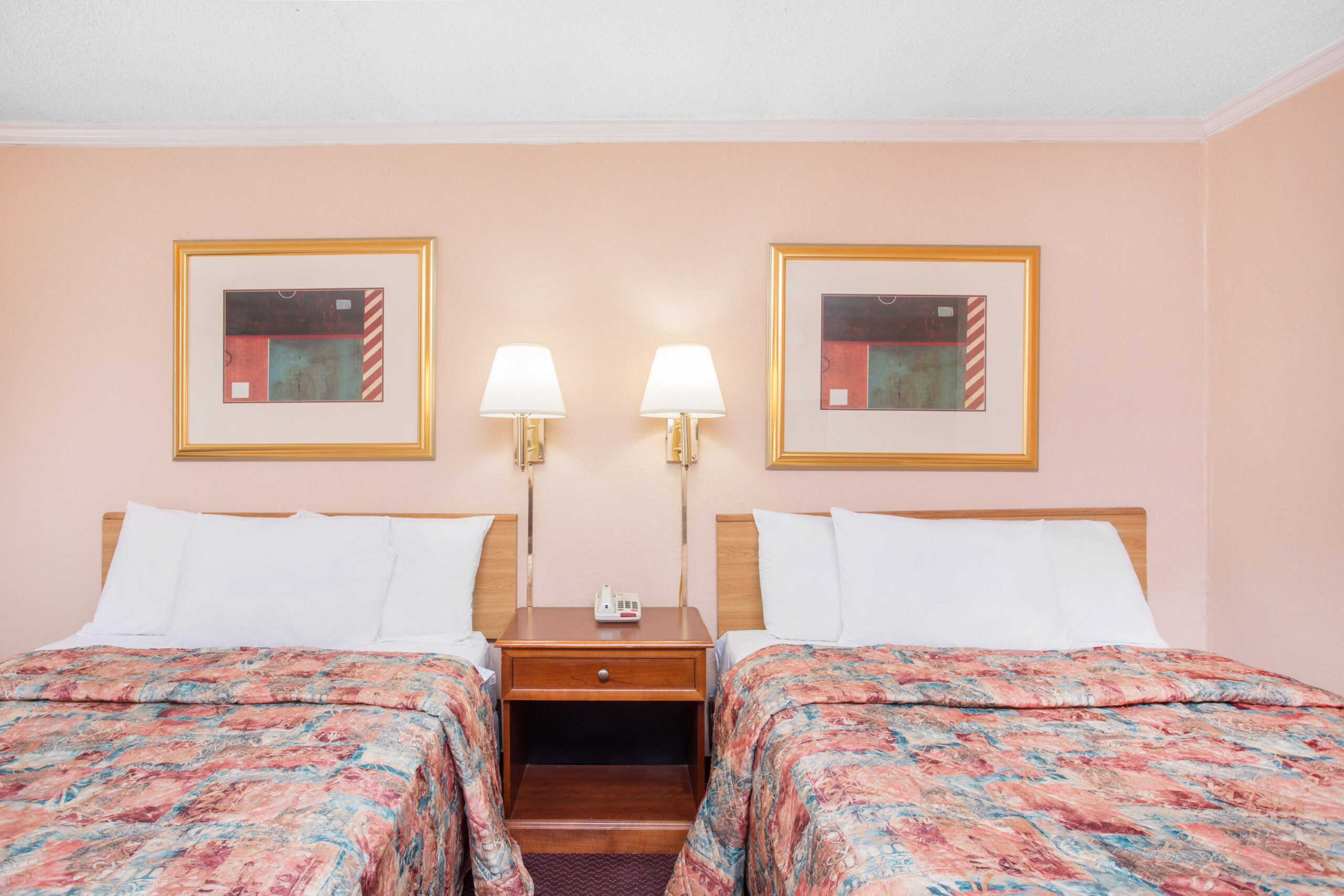 Hotel room with two double beds.