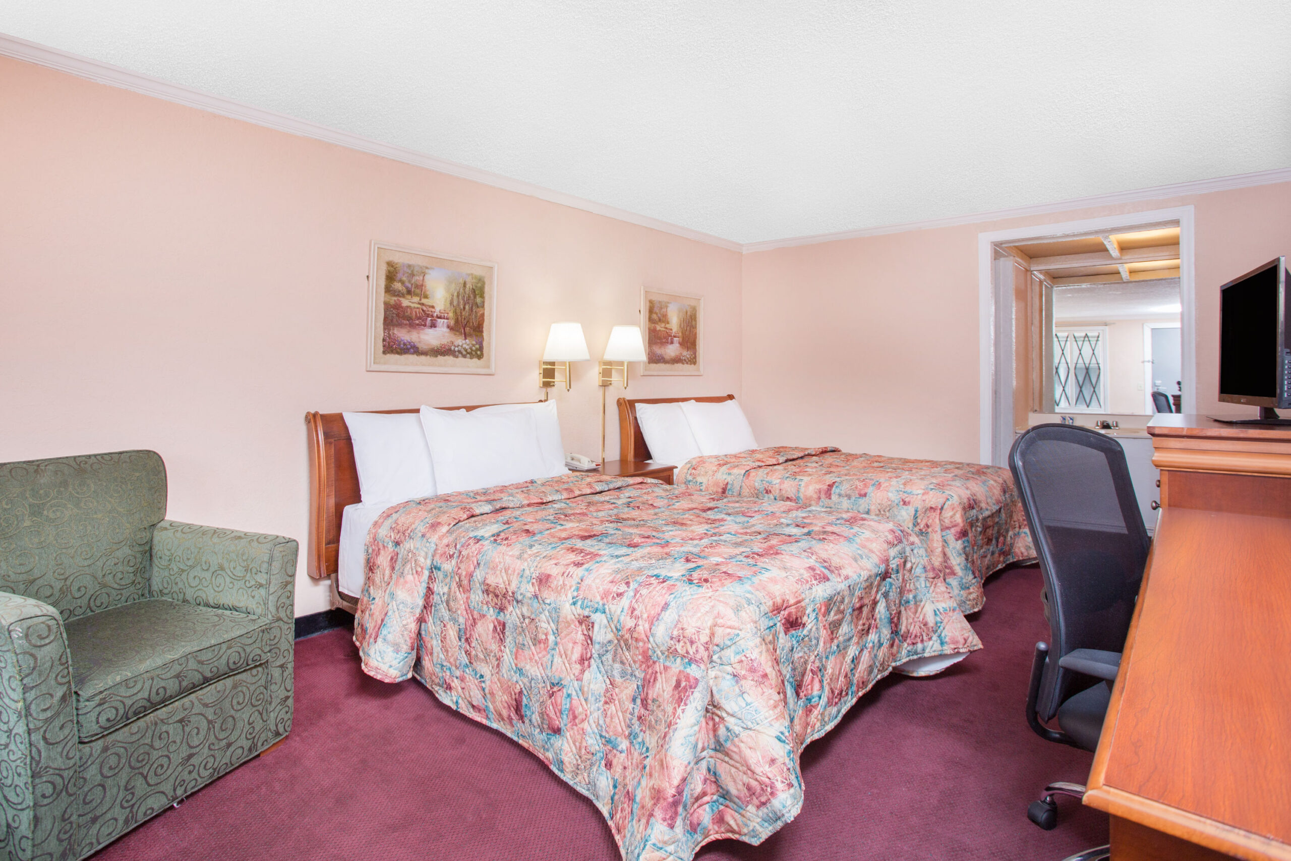 Hotel room with two double beds.