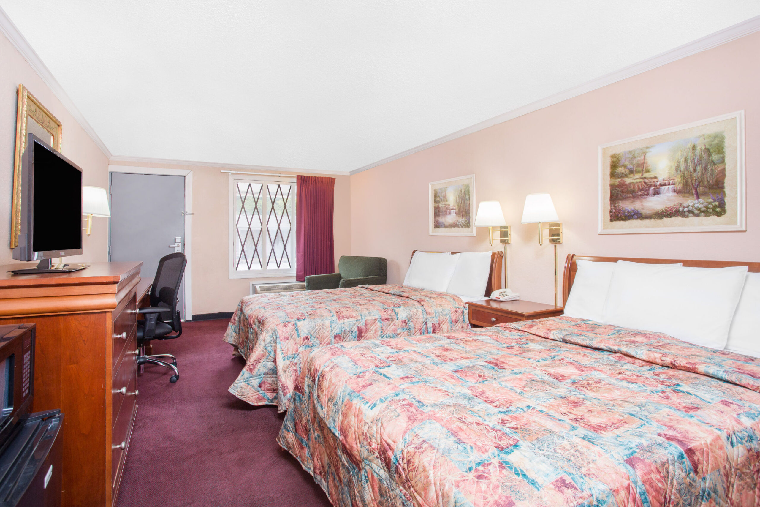 Hotel room with two double beds.
