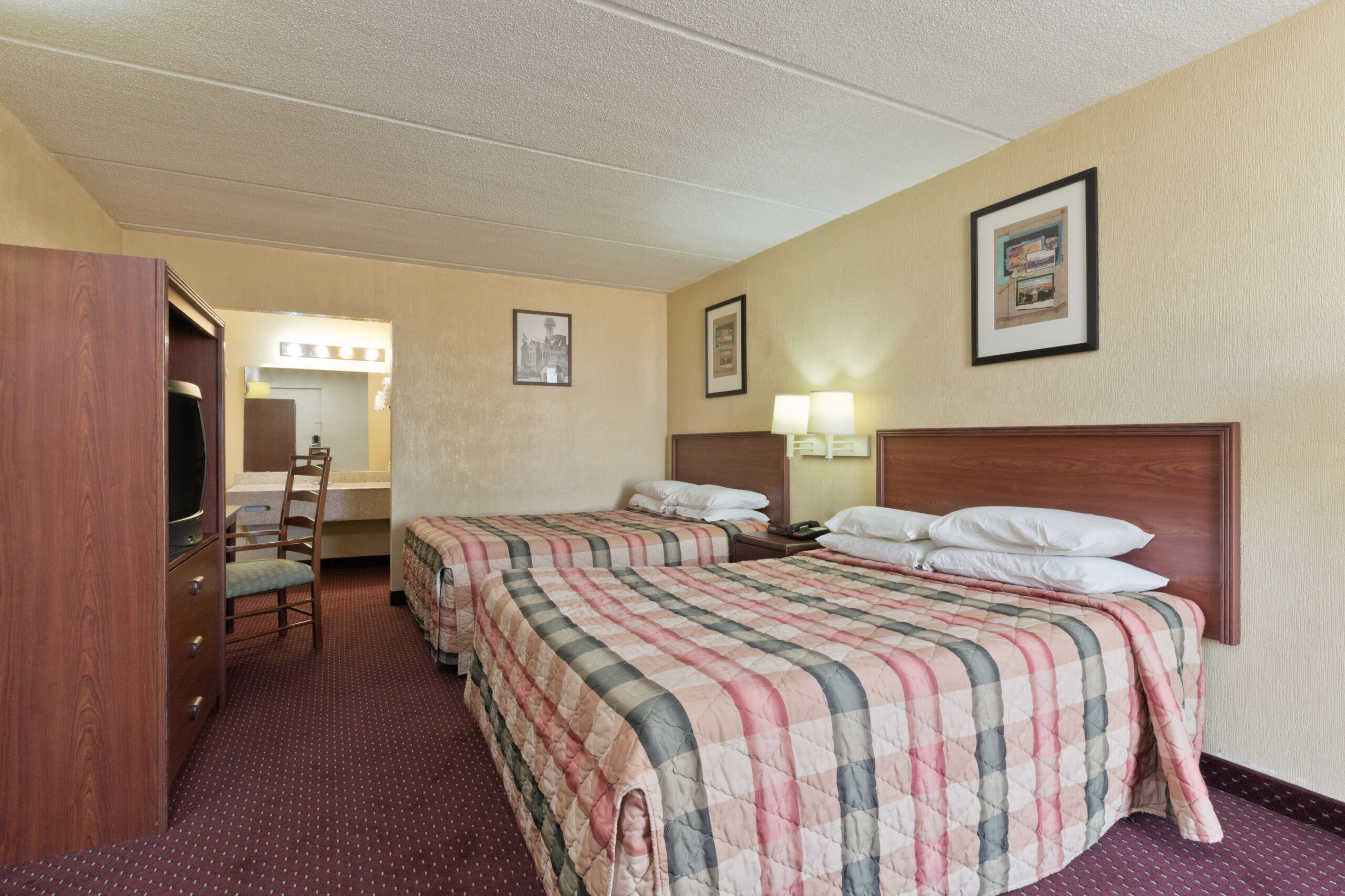 Hotel room with two double beds.