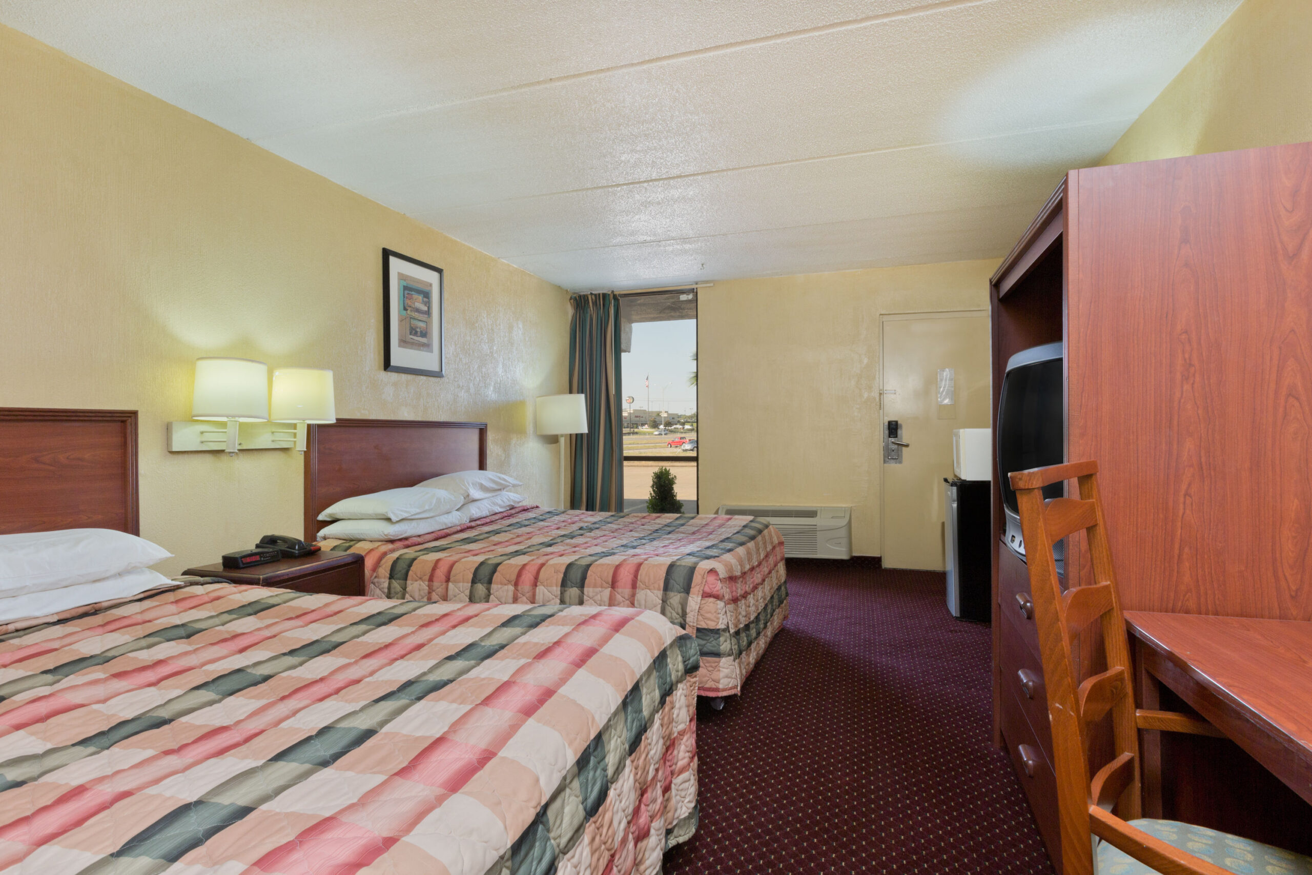 Hotel room with two double beds.