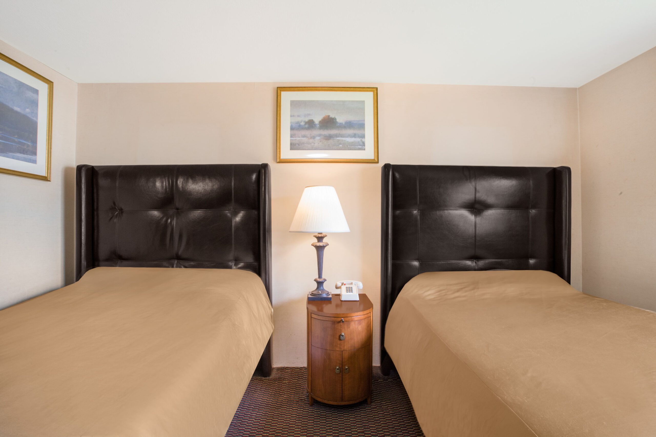Hotel room with two double beds.