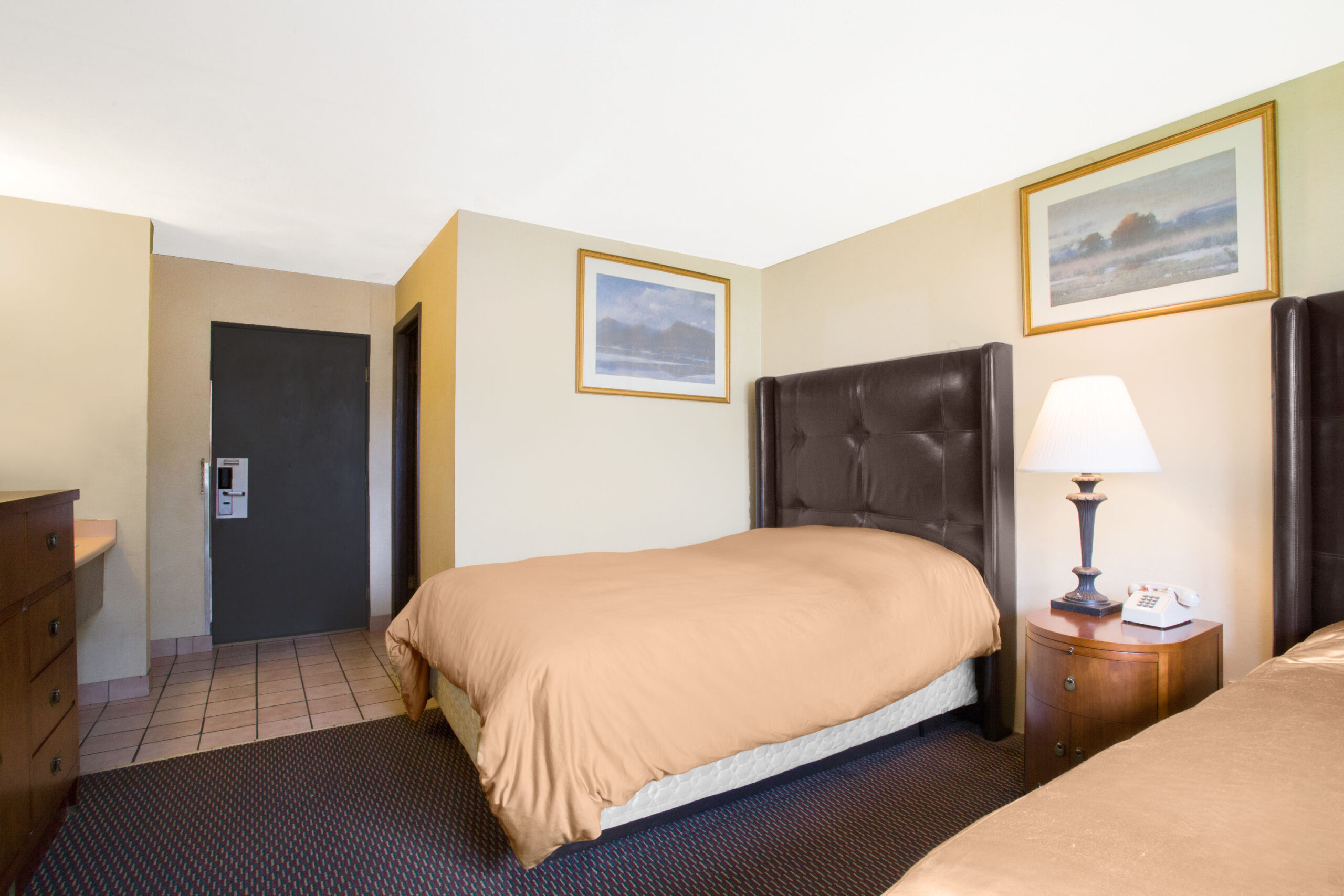 Hotel room with two double beds.