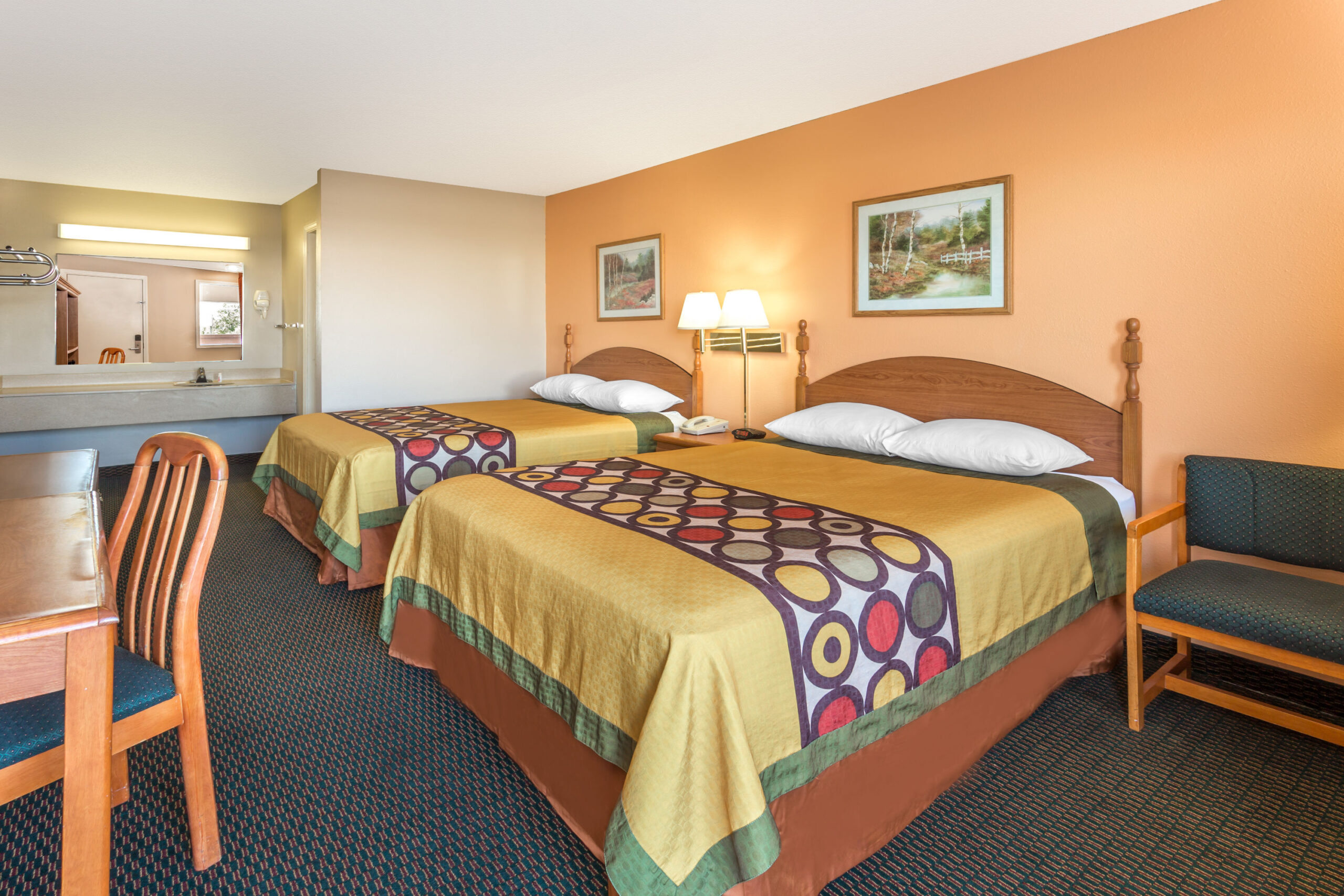 Hotel room with two double beds.
