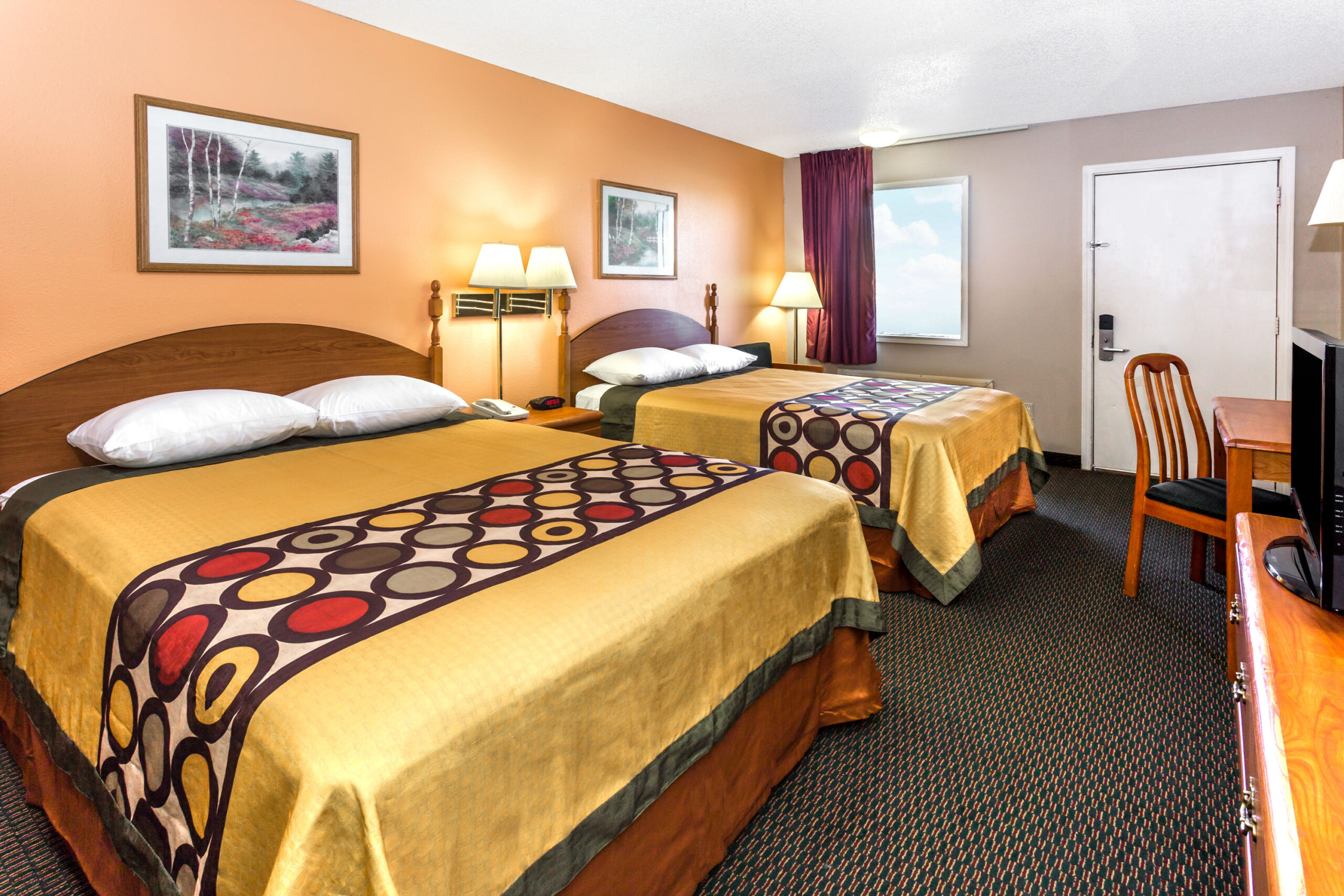 Hotel room with two double beds.