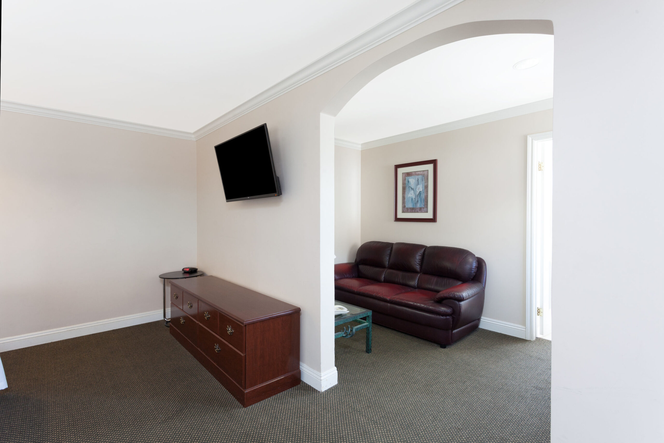 Hotel room living area with a TV.