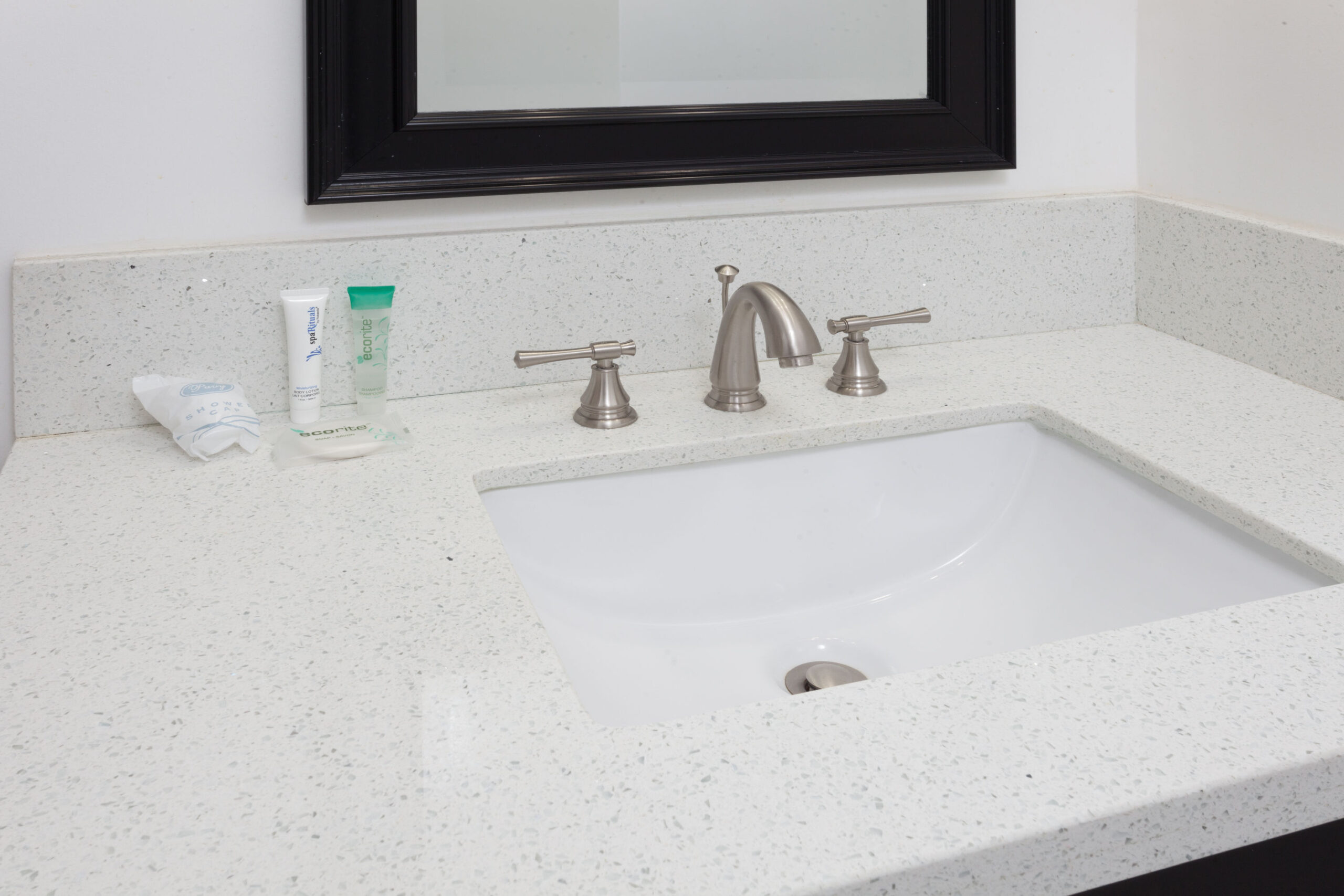Hotel room bathroom sink.