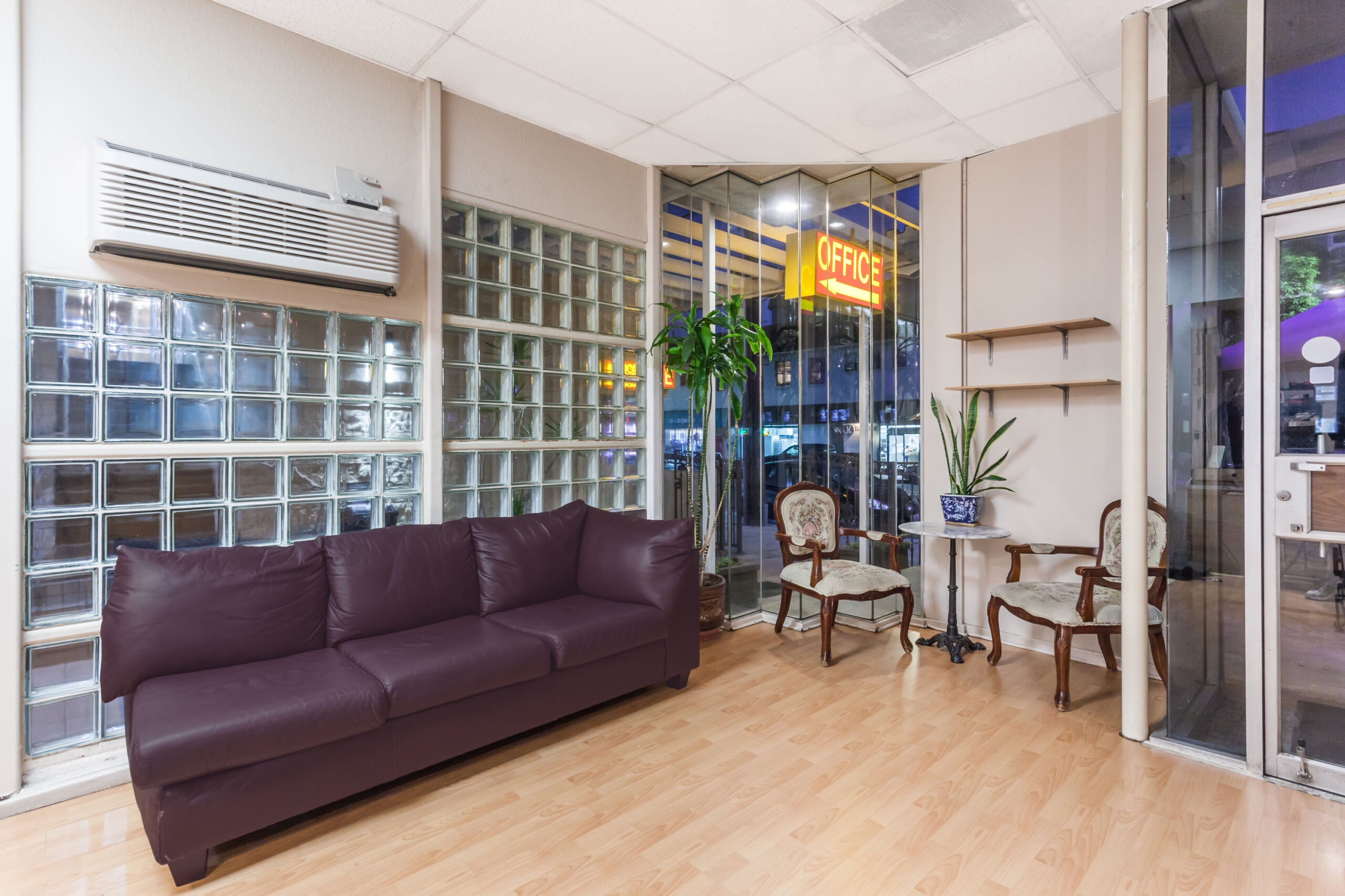 Hotel lobby area with purple couch.