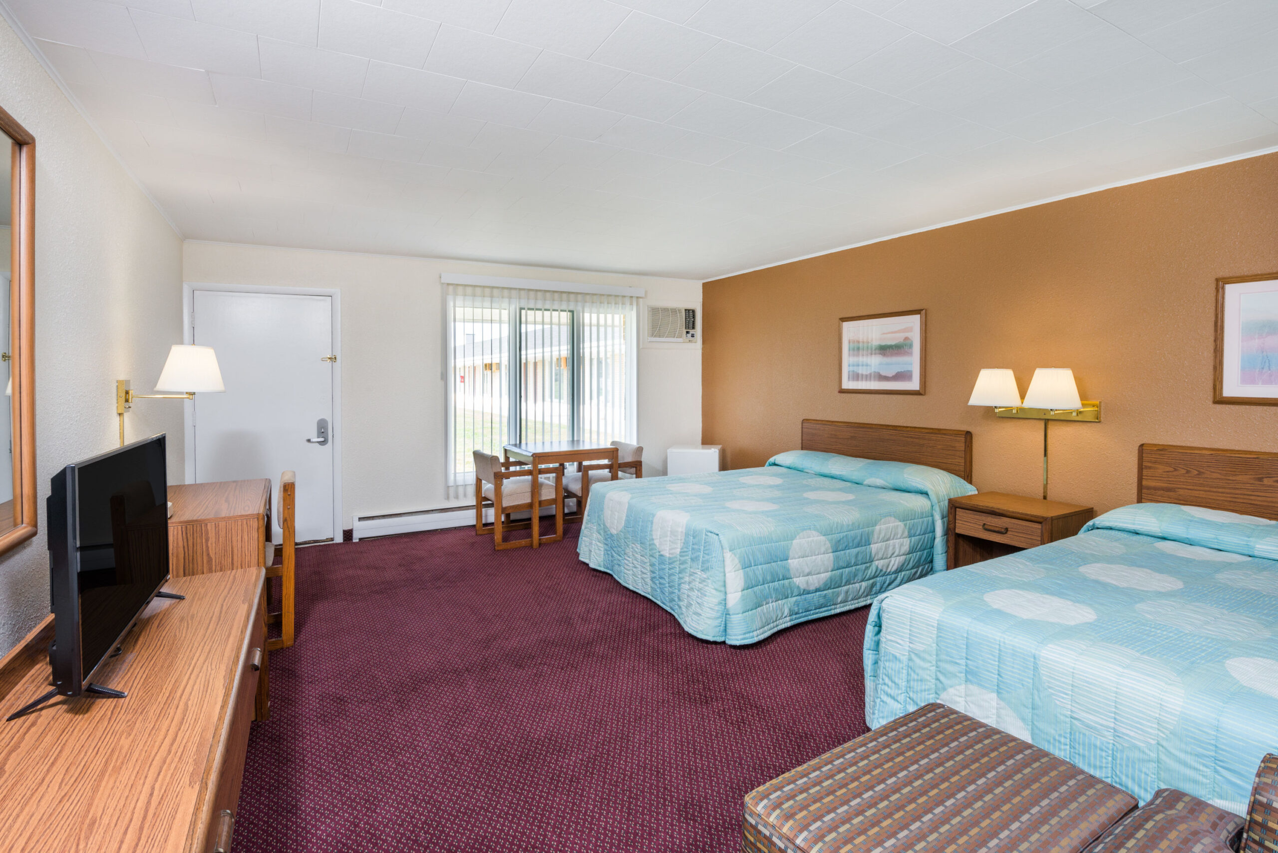 Hotel room with two double beds.