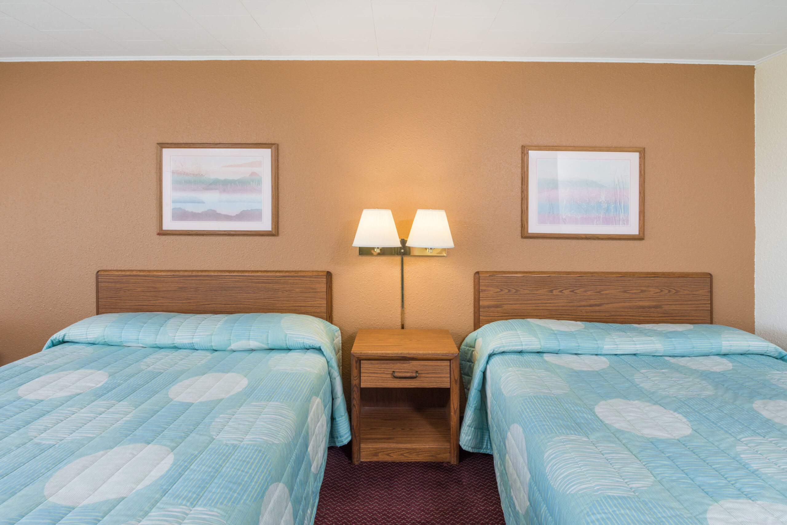 Hotel room with two double beds.