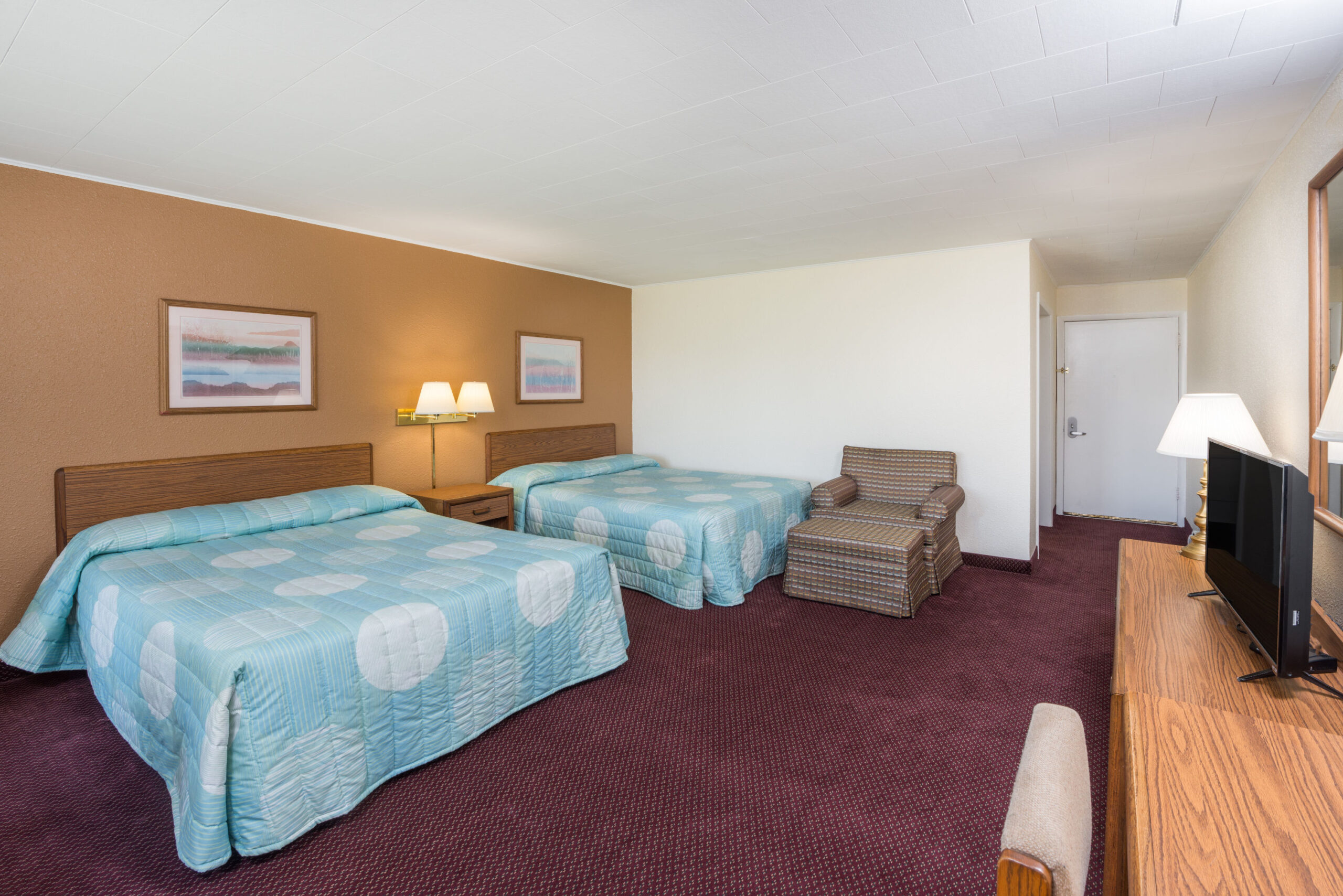 Hotel room with two double beds.