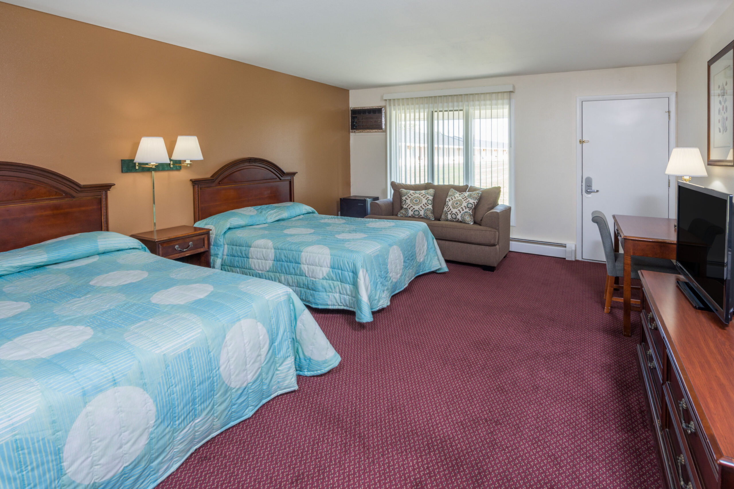 Hotel room with two double beds.