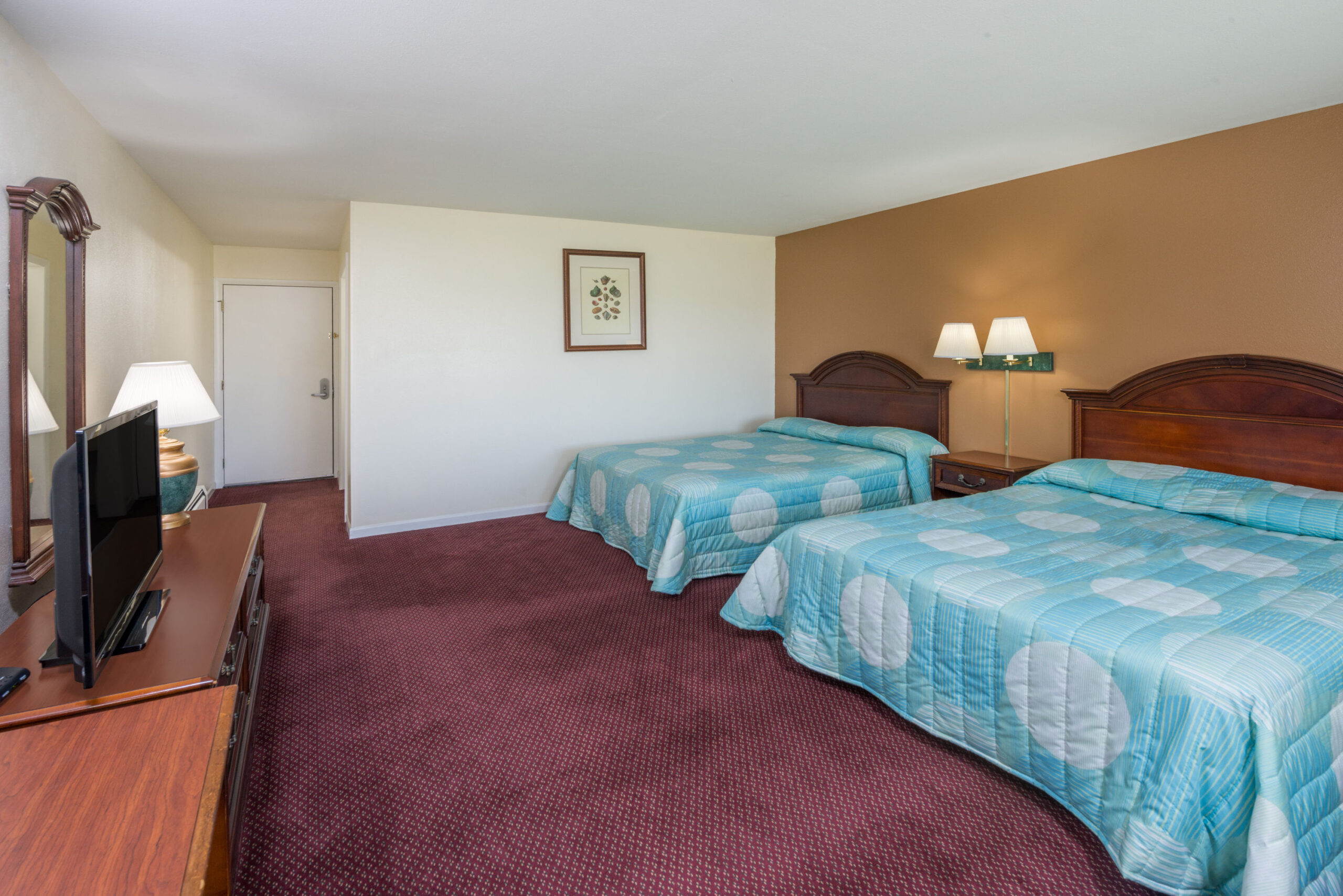 Hotel room with two double beds.