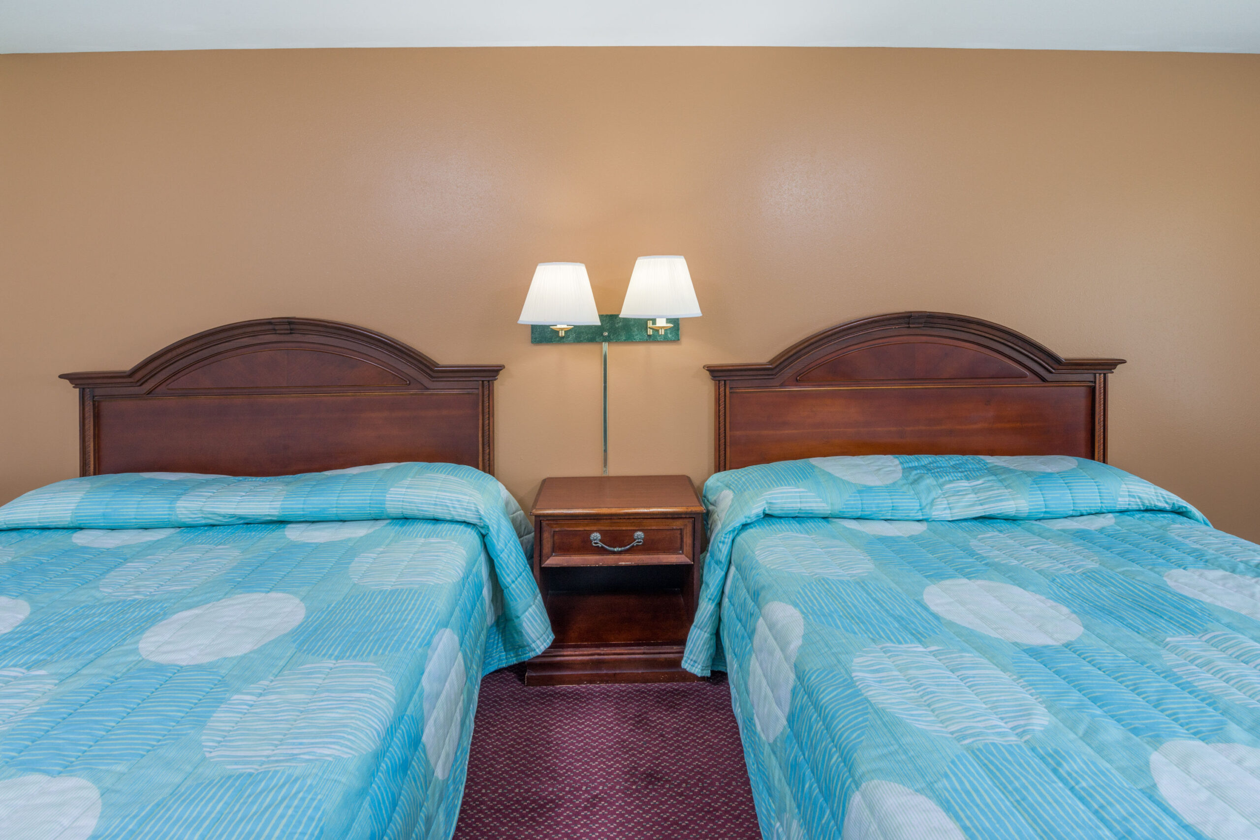 Hotel room with two double beds.