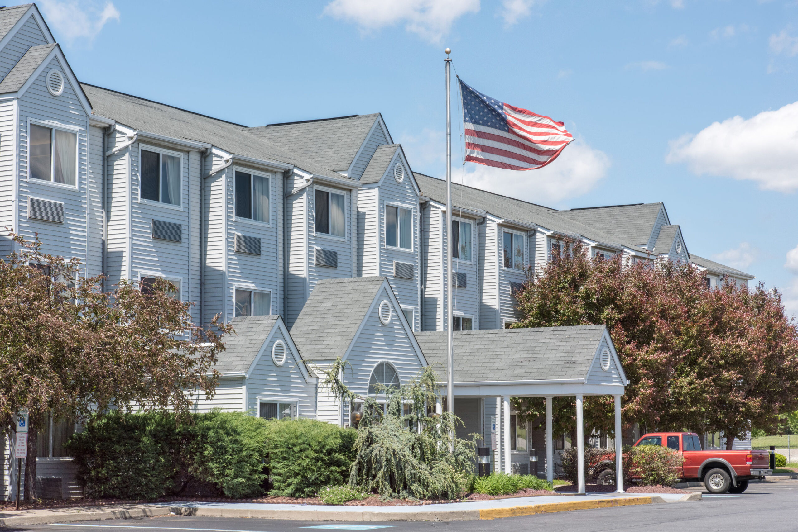 Hotel exterior at noon.