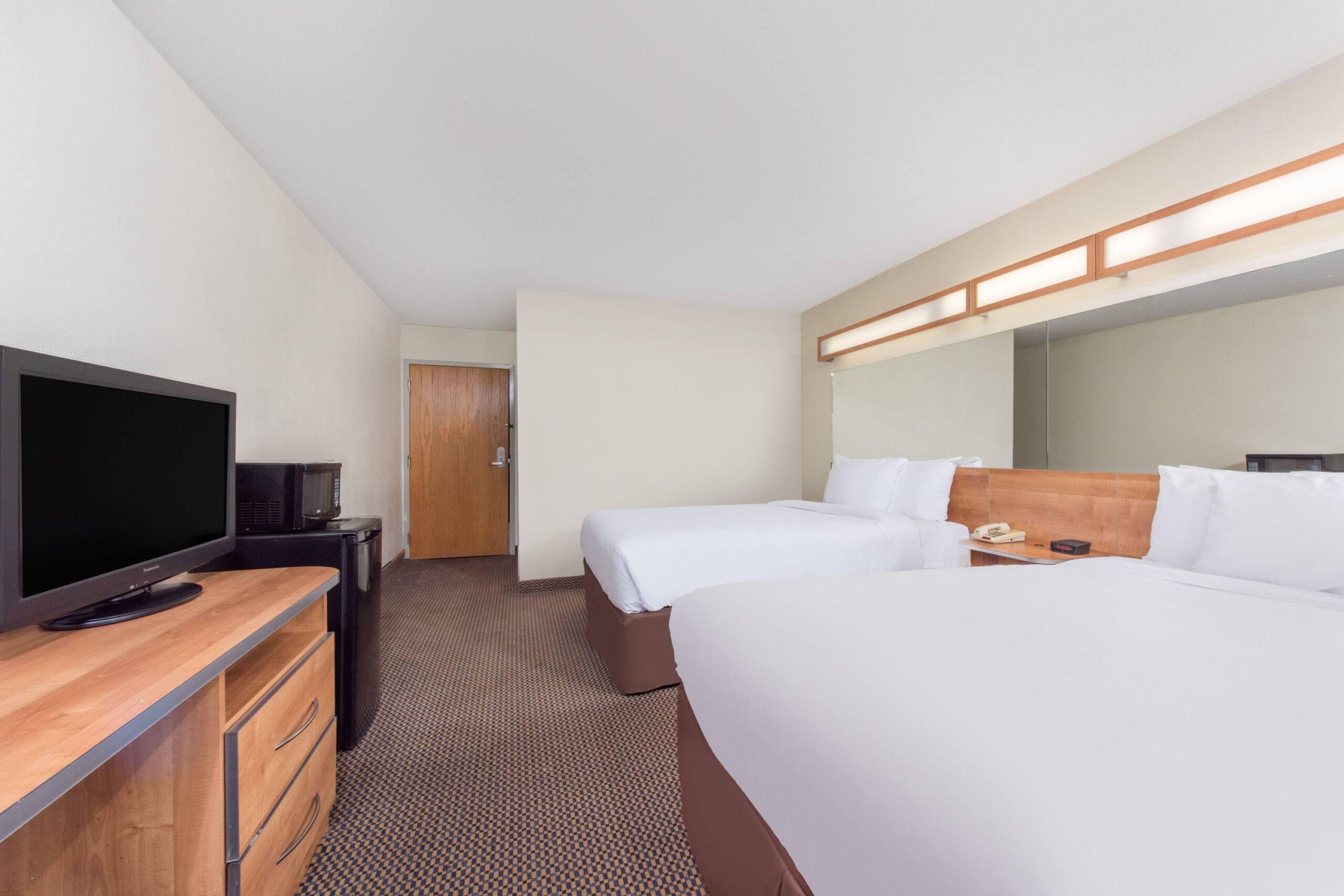 Hotel room with two double beds.