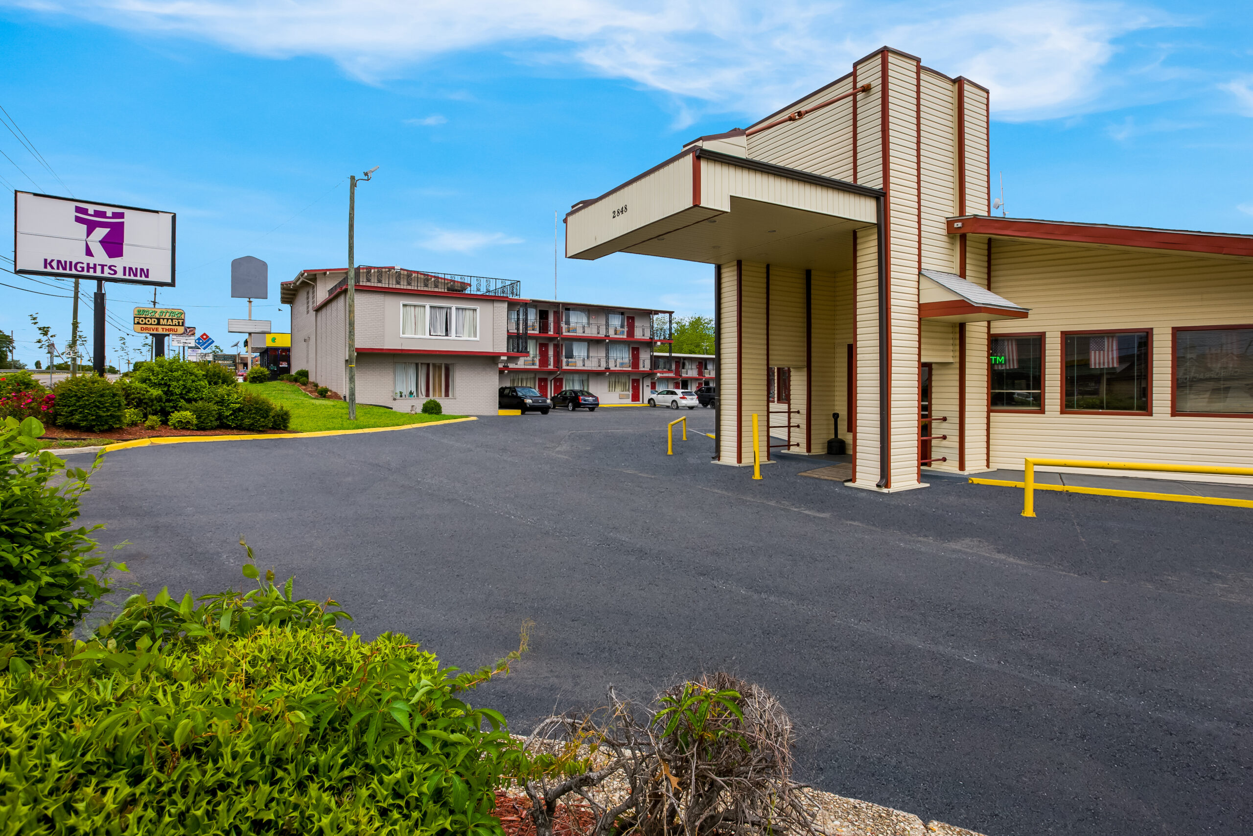 Hotel exterior at noon.