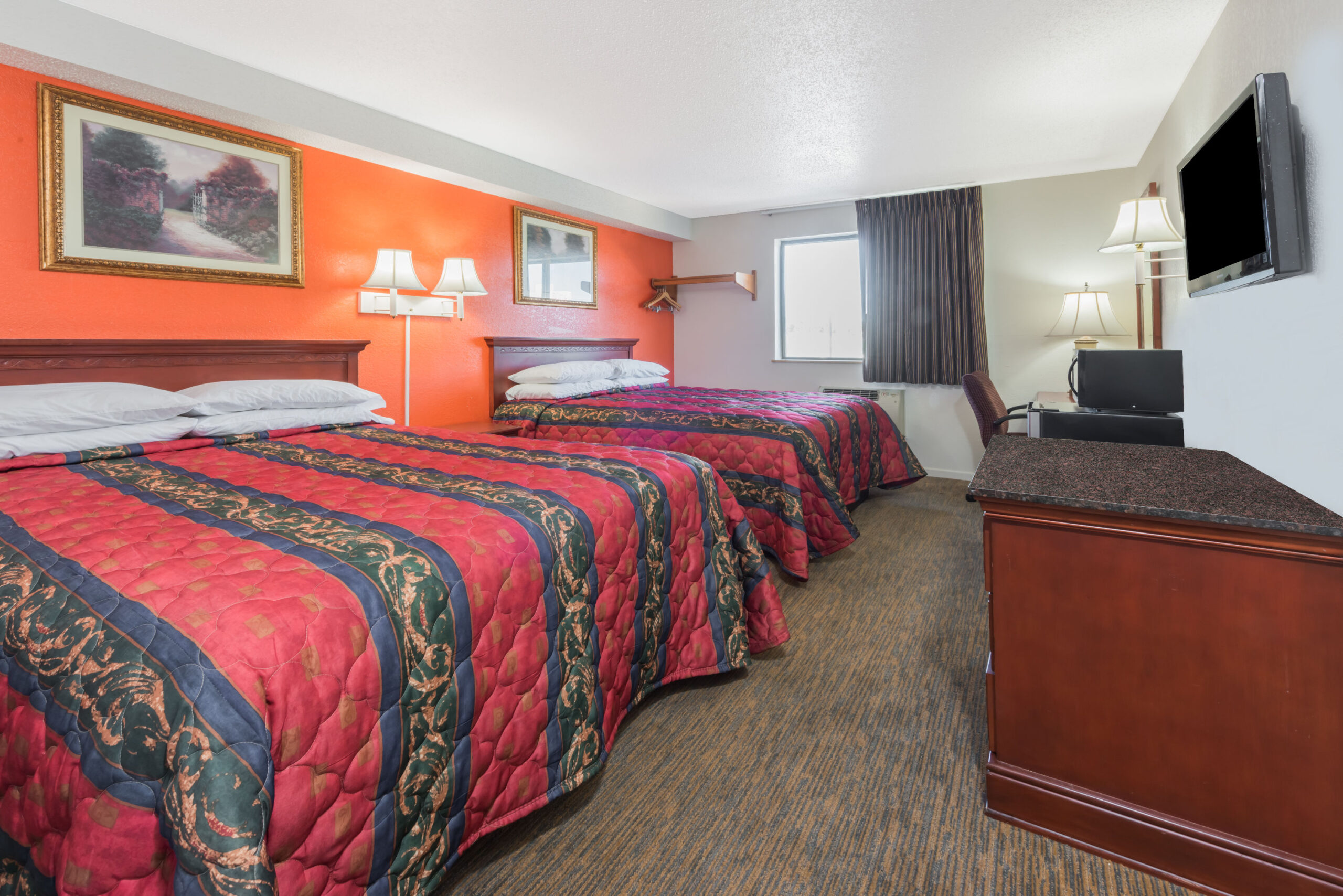Hotel room with two double beds.