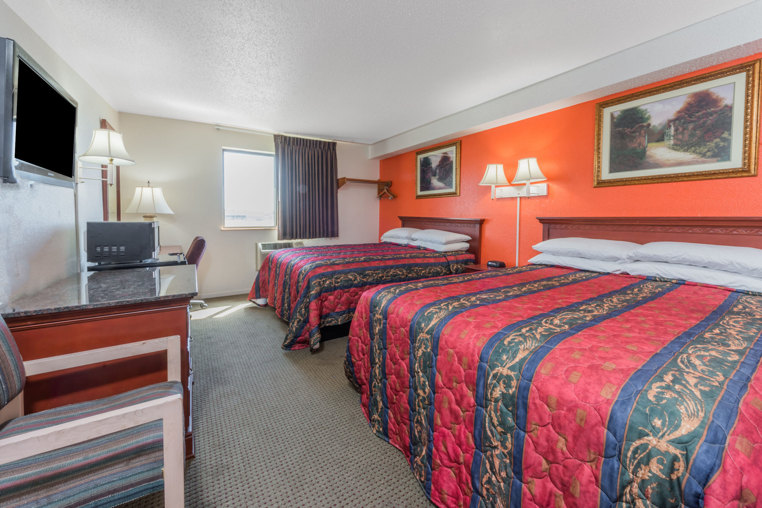 Hotel room with two double beds.