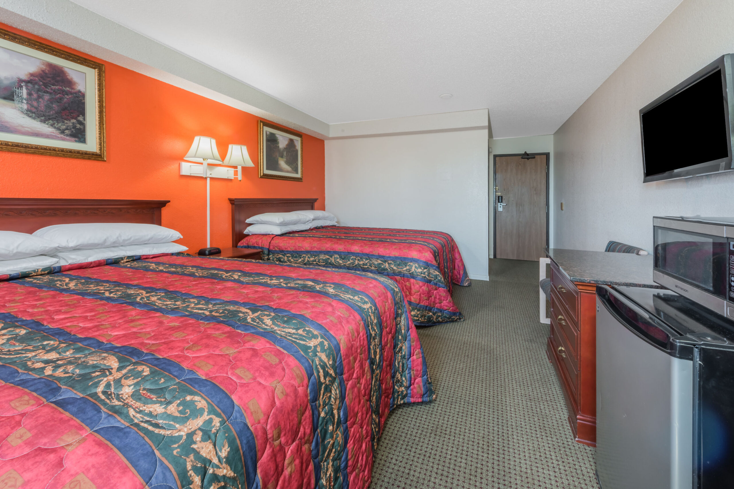 Hotel room with two double beds.