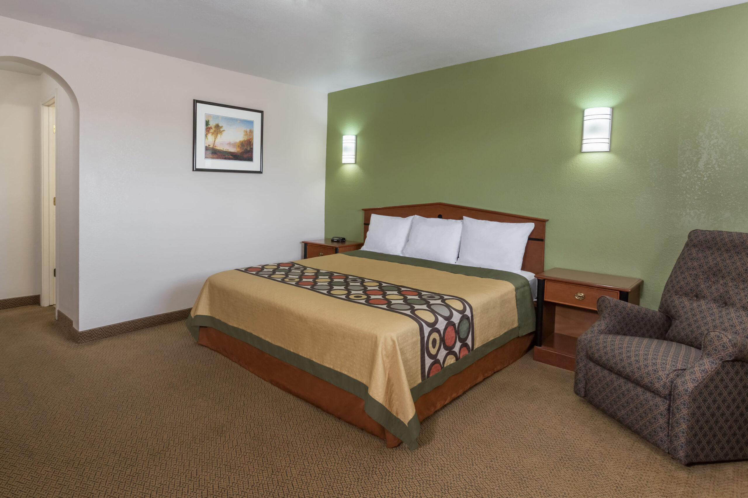 Hotel room with a queen bed.