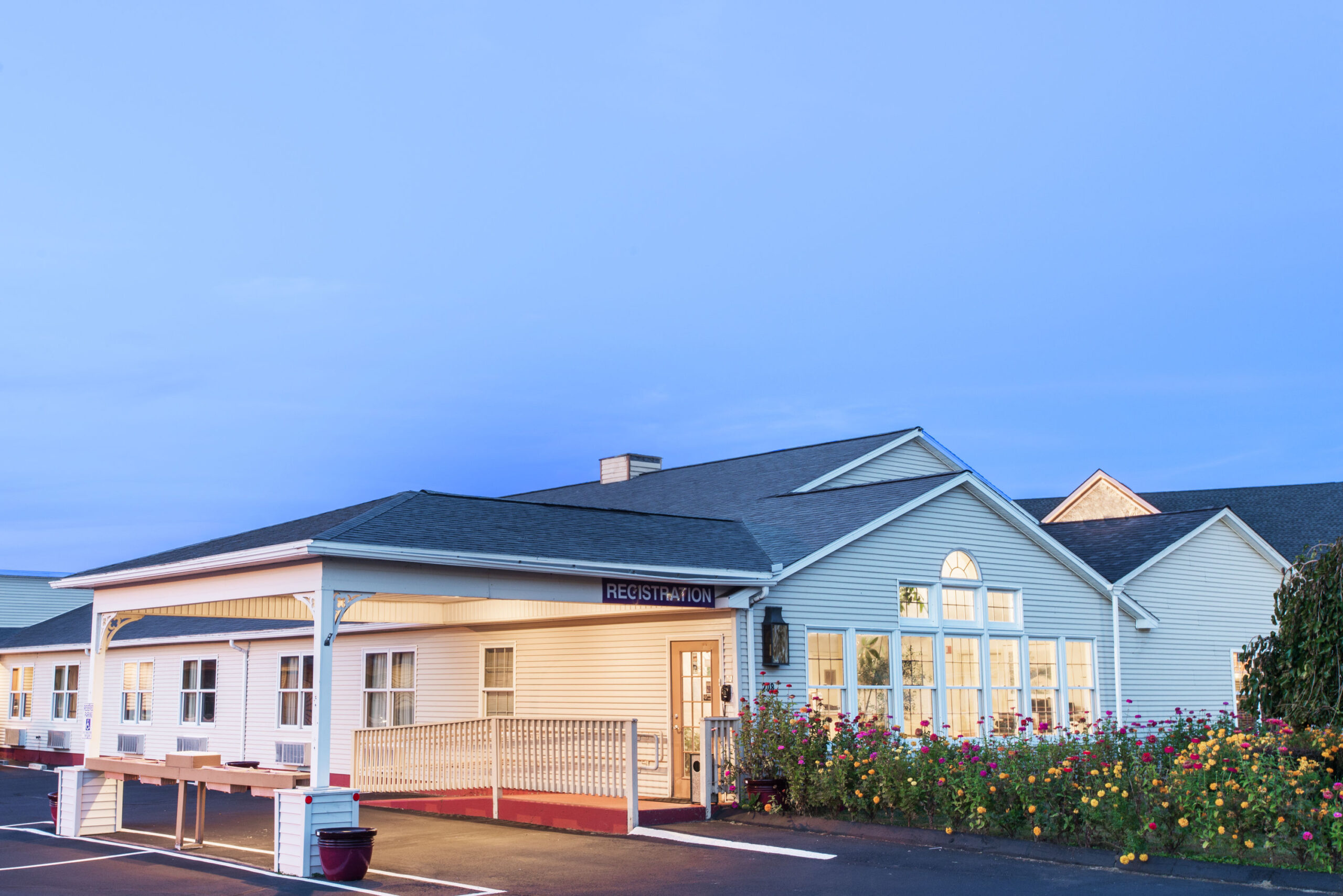 Hotel exterior at night.